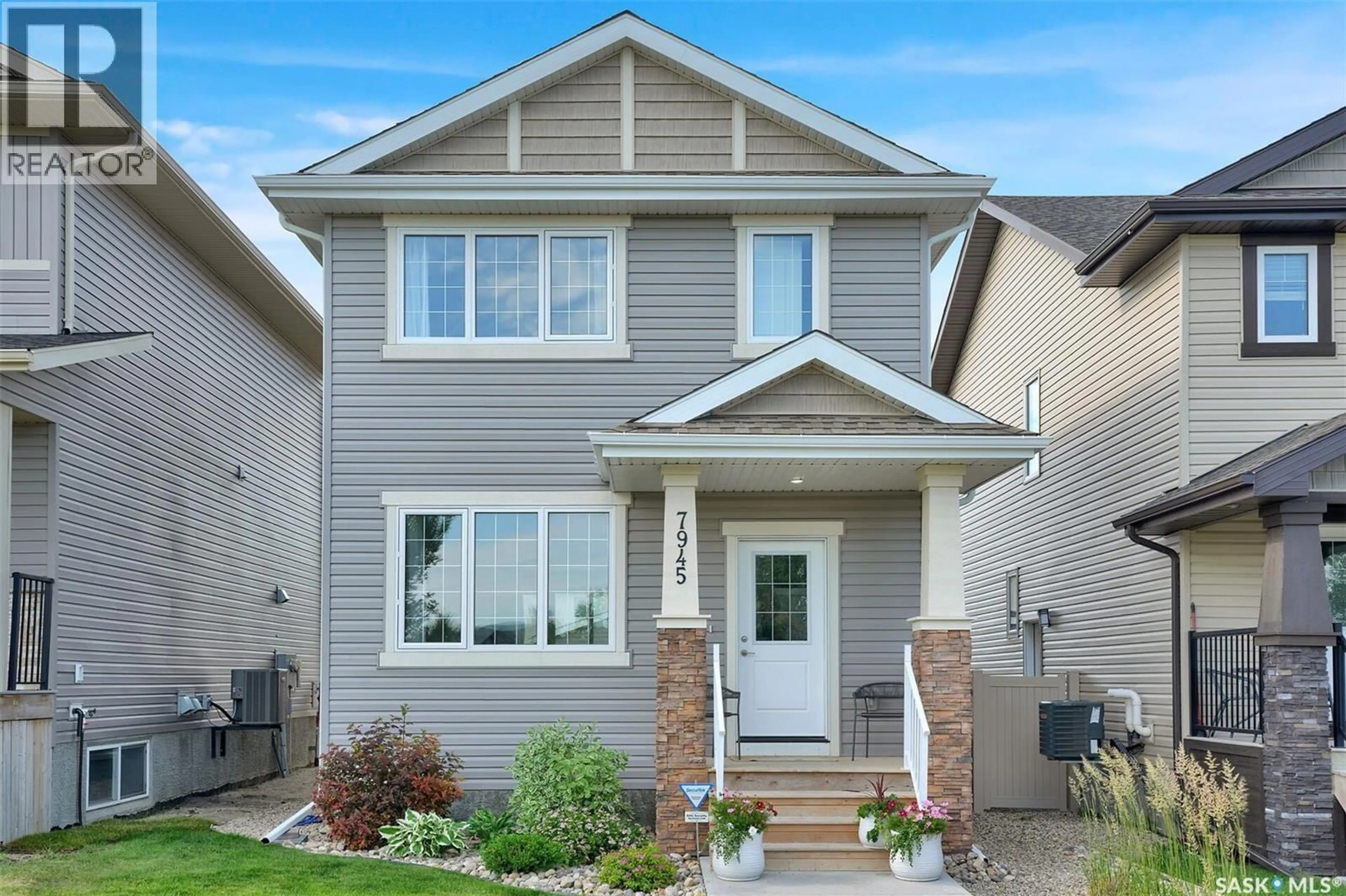 Home with vinyl exterior material, street for 7945 FLAX AVENUE, Regina Saskatchewan S4Y0E6