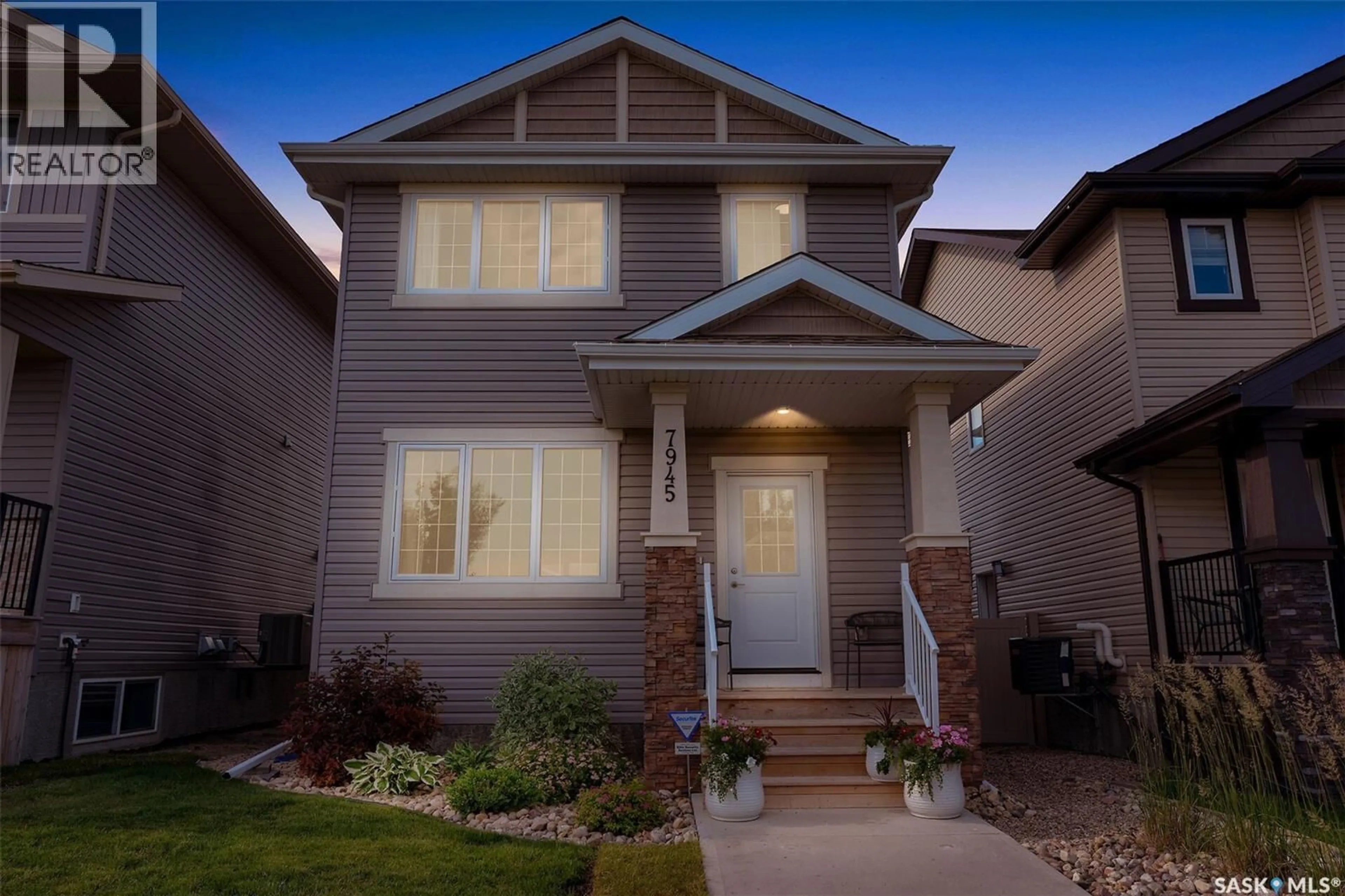Home with vinyl exterior material, street for 7945 FLAX AVENUE, Regina Saskatchewan S4Y0E6