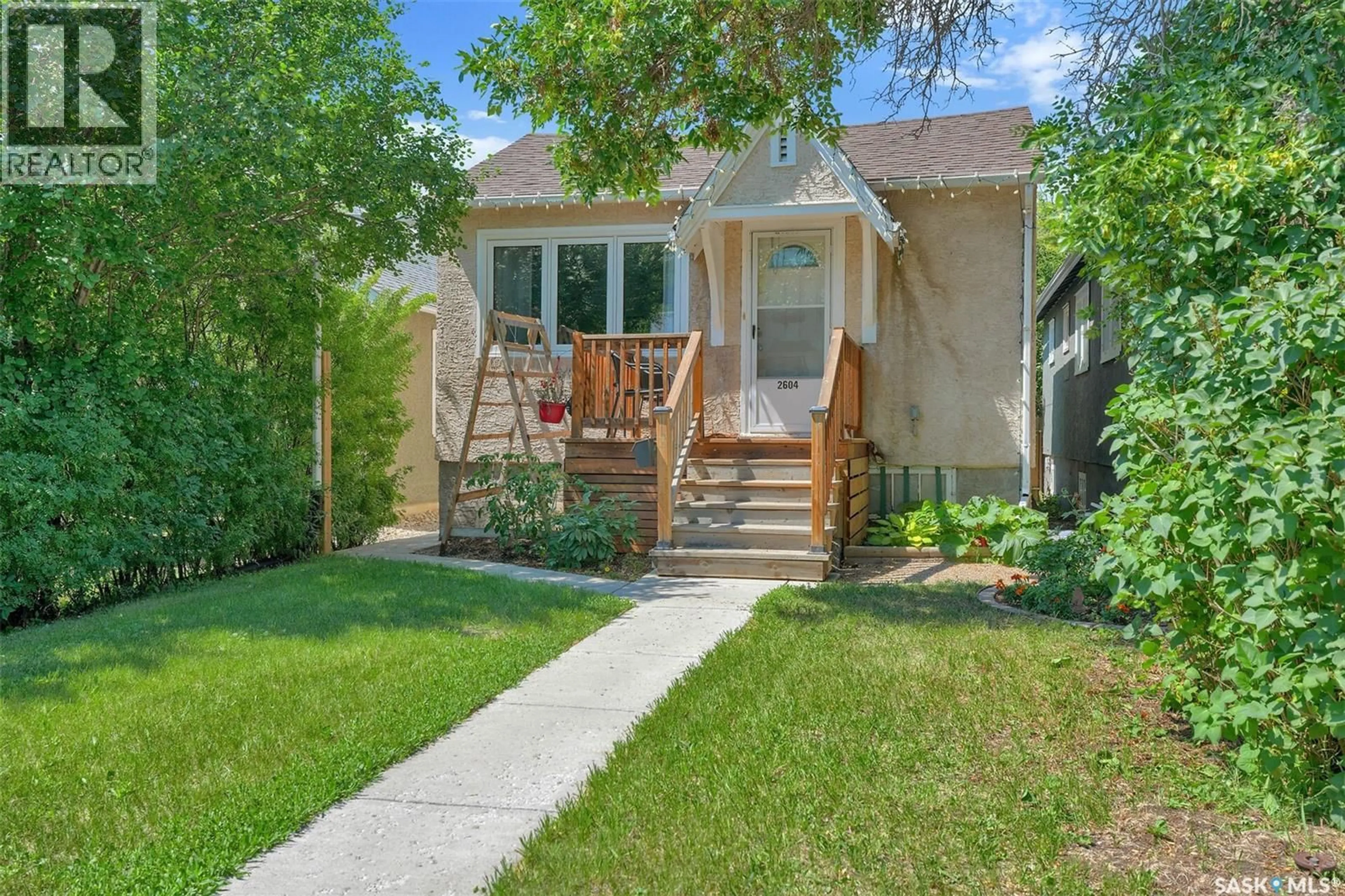 Home with vinyl exterior material, street for 2604 ROBINSON STREET, Regina Saskatchewan S4T2R4