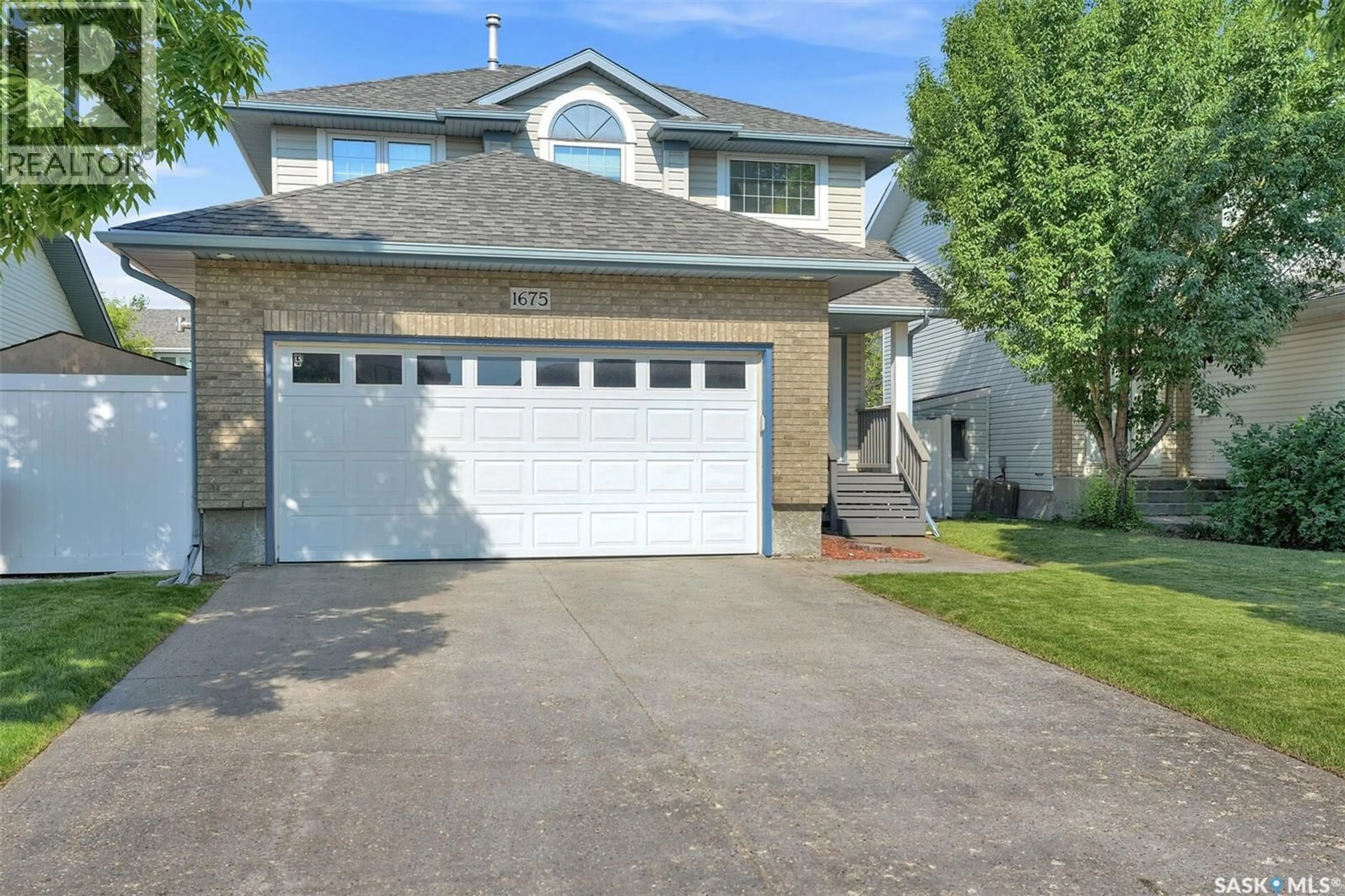 Home with vinyl exterior material, street for 1675 ROUSSEAU CRESCENT, Regina Saskatchewan S4X4L9
