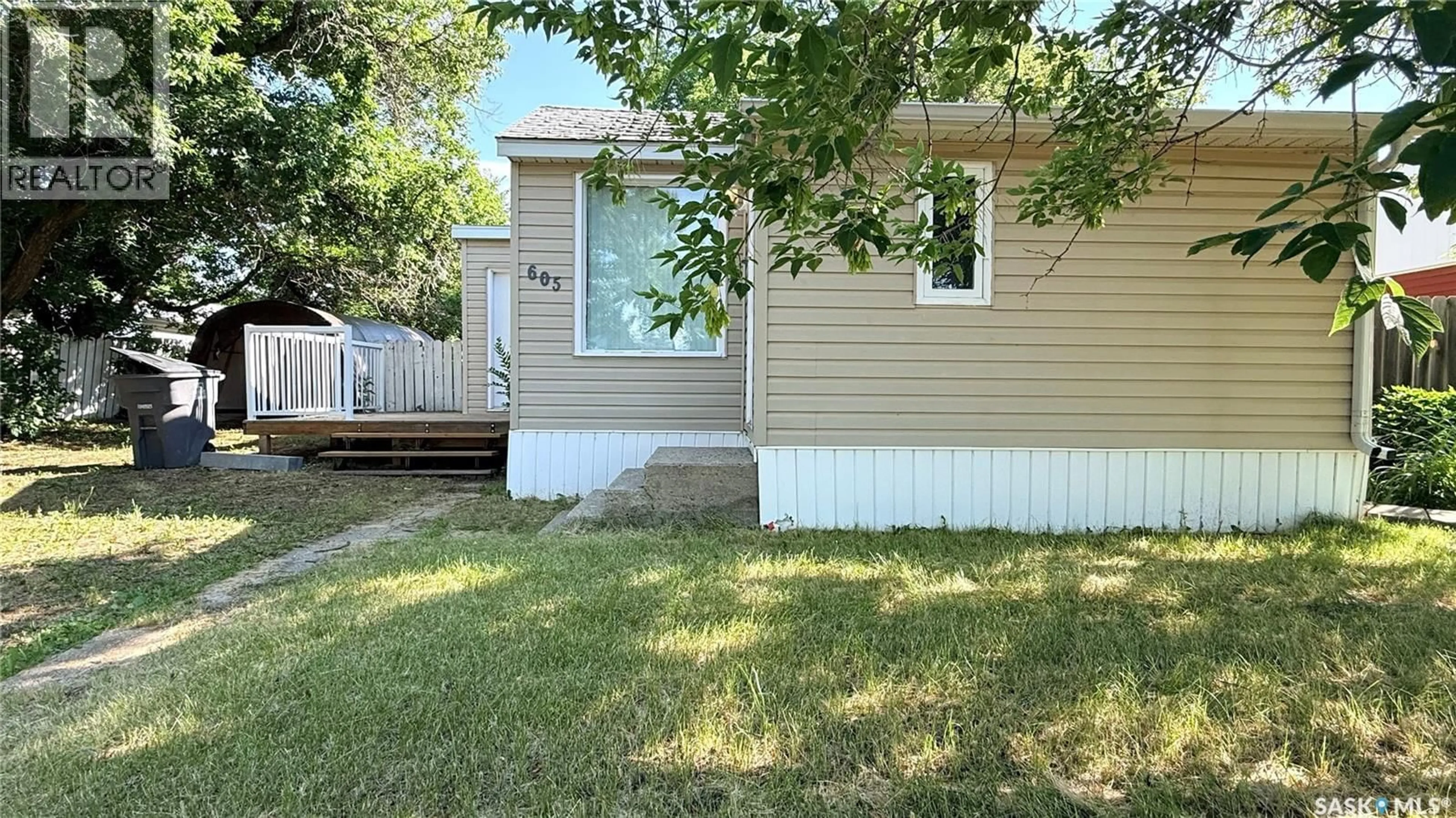 Home with vinyl exterior material, street for 605 2ND STREET, Estevan Saskatchewan S4A2K8
