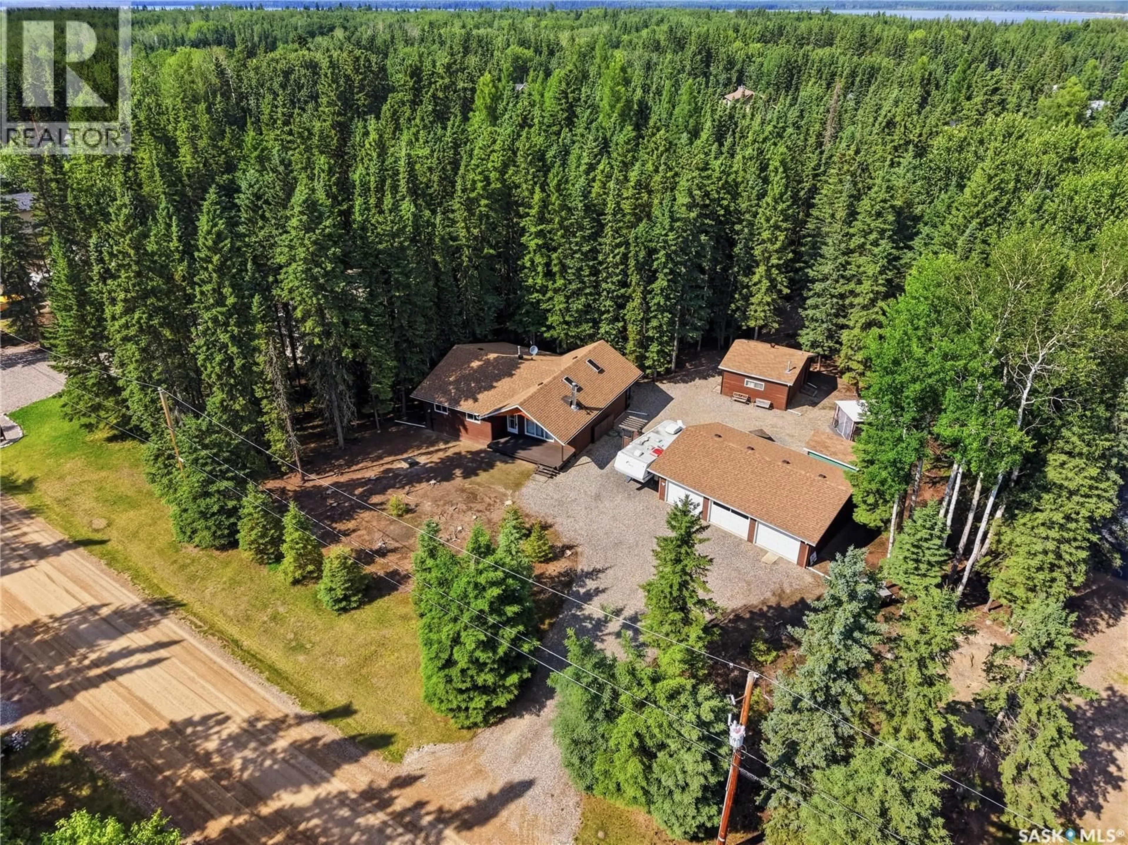 A pic from outside/outdoor area/front of a property/back of a property/a pic from drone, forest/trees view for 23 SASKATCHEWAN DRIVE, Candle Lake Saskatchewan S0J3E0