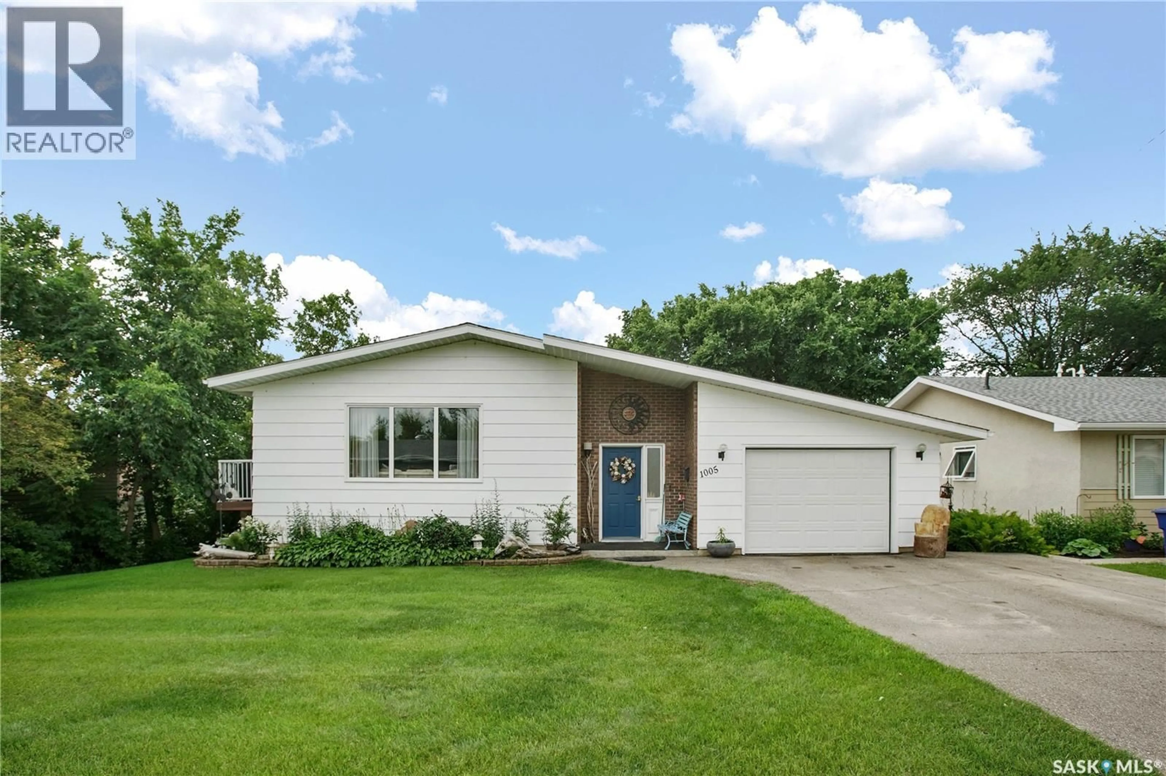 Home with vinyl exterior material, street for 1005 10TH STREET, Rosthern Saskatchewan S0K3R0