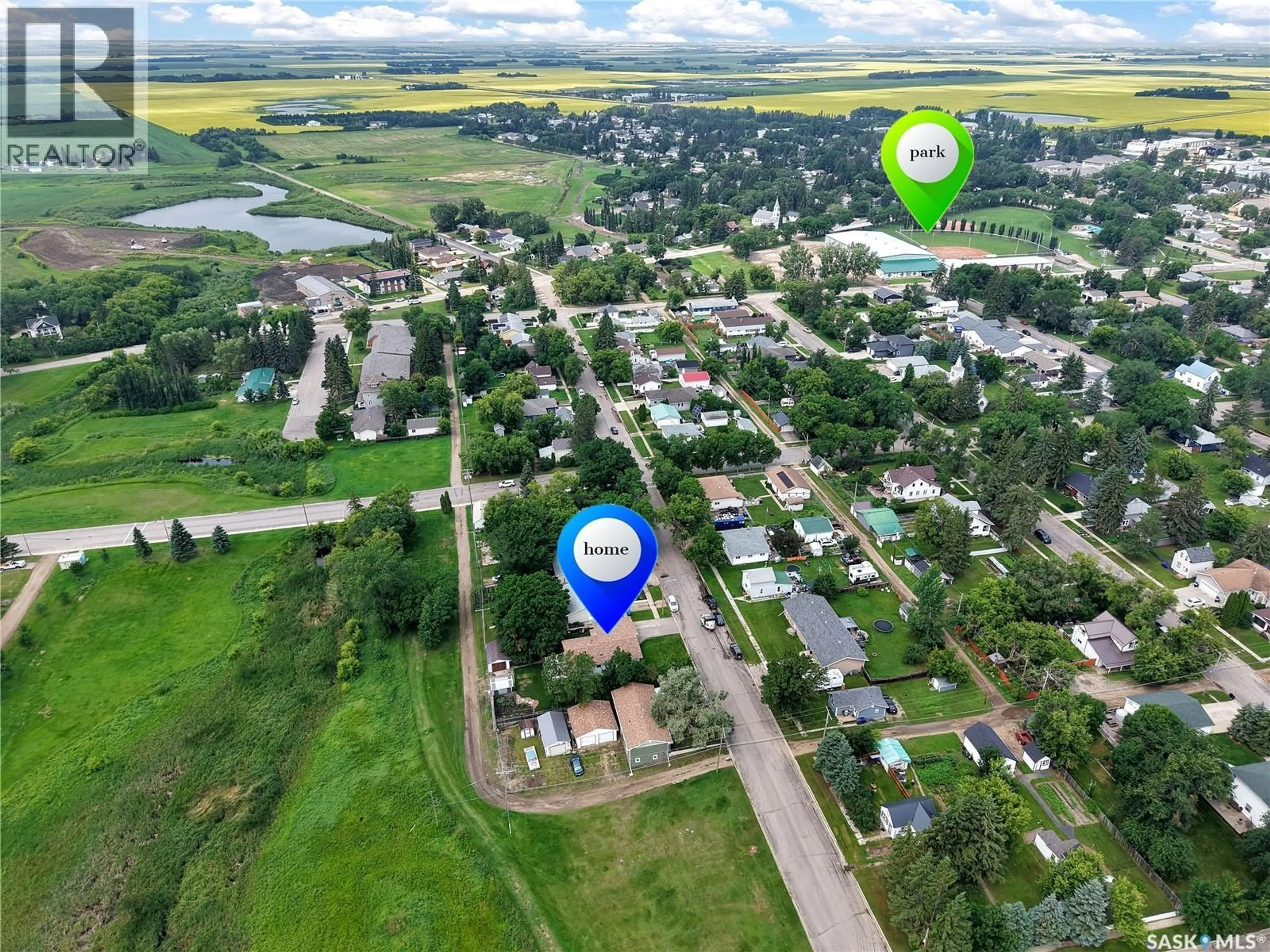 A pic from outside/outdoor area/front of a property/back of a property/a pic from drone, unknown for 1005 10TH STREET, Rosthern Saskatchewan S0K3R0