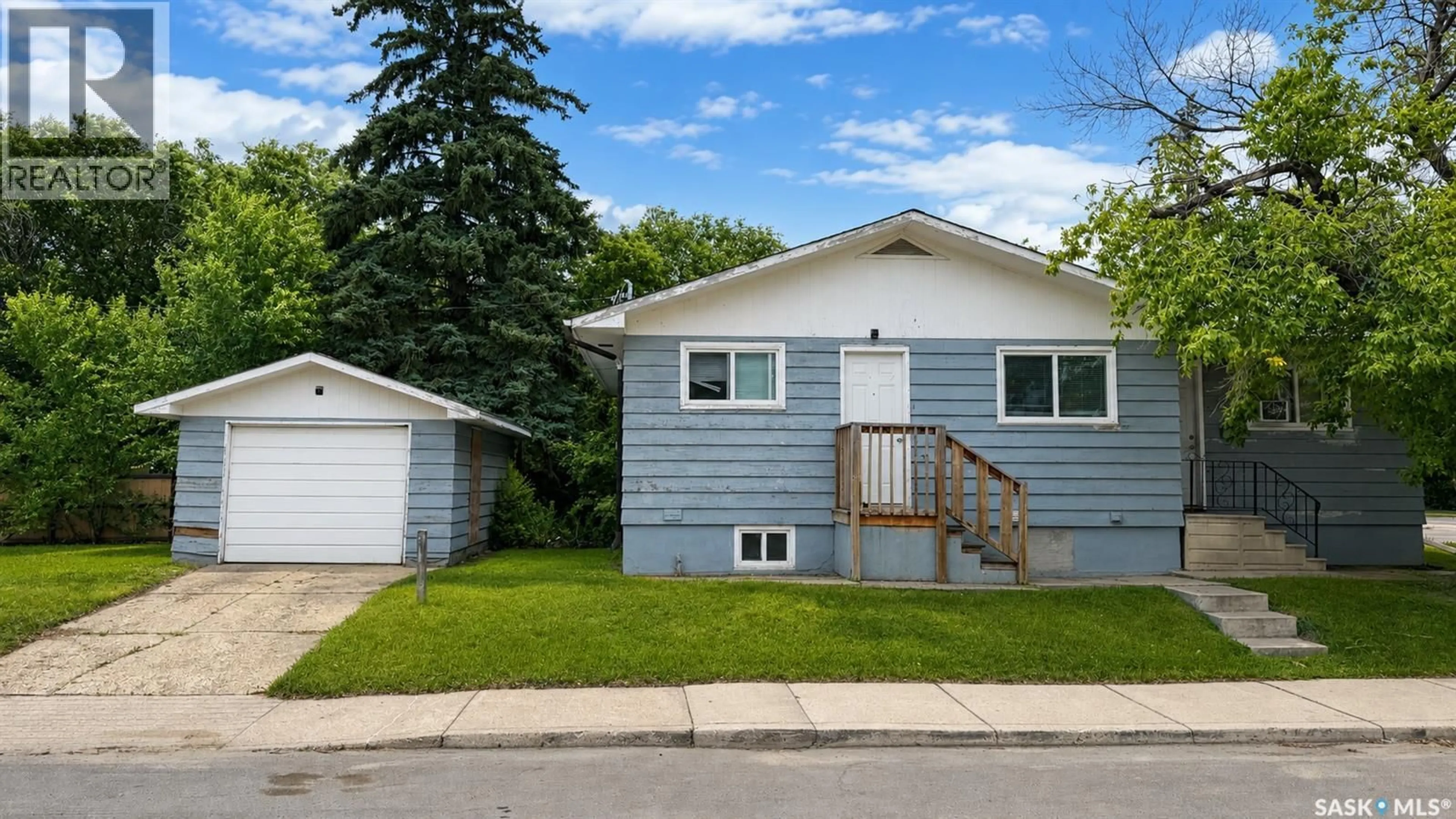 Home with vinyl exterior material, street for 1924 22ND STREET, Saskatoon Saskatchewan S7M0T9