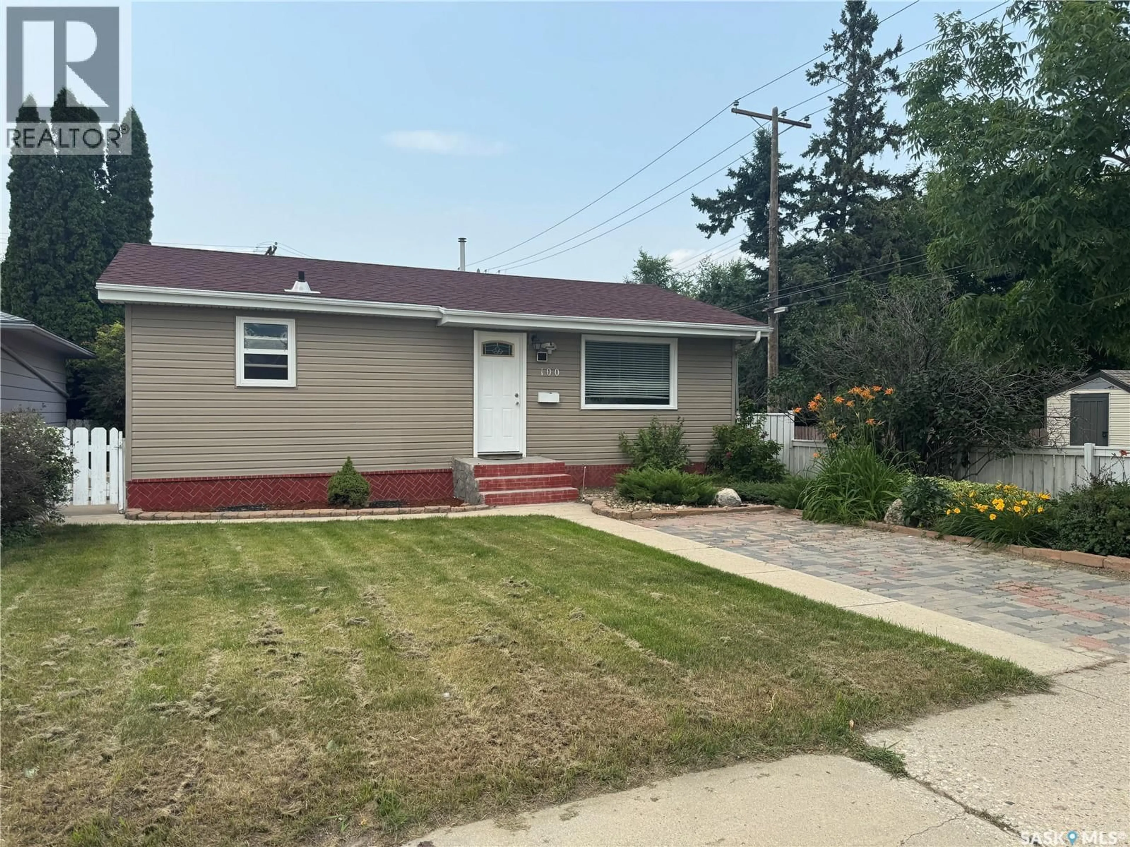 Home with vinyl exterior material, street for 100 105TH STREET, Saskatoon Saskatchewan S7N1N1