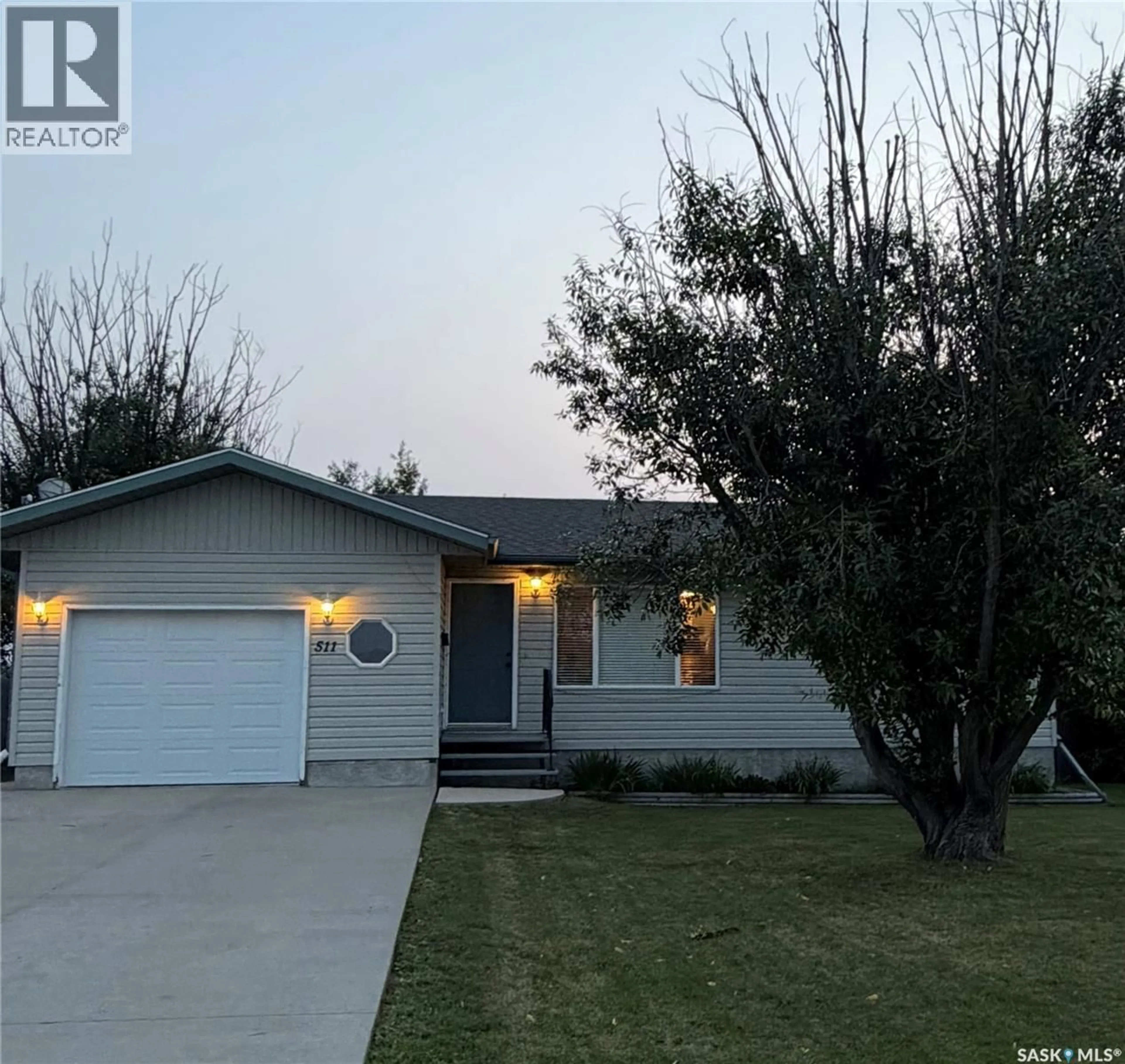 Home with vinyl exterior material, street for 511 MACMILLIAN STREET, Hudson Bay Saskatchewan S0E0Y0