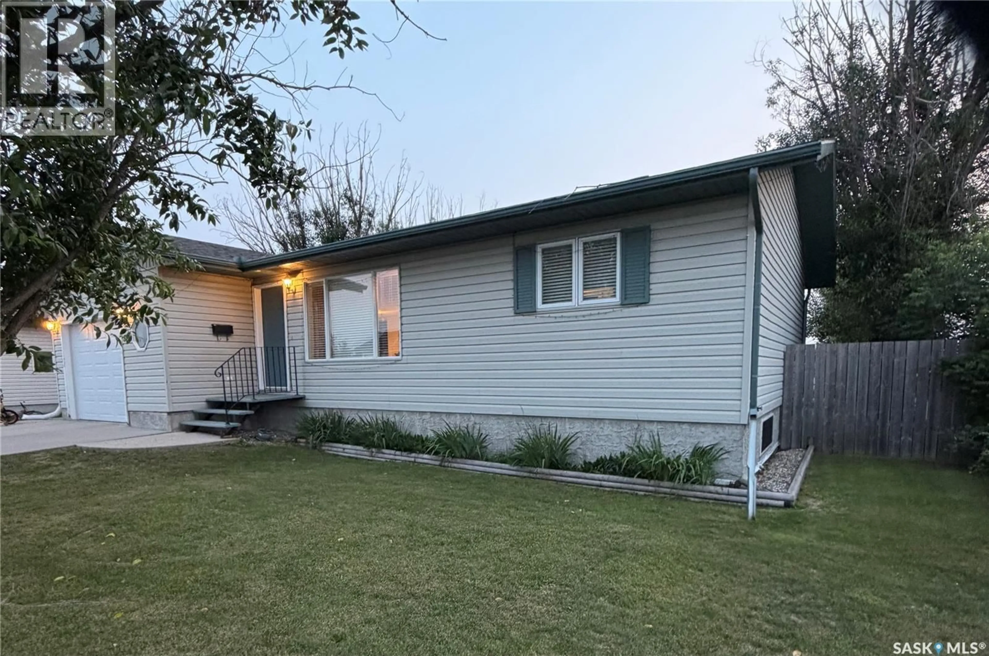 Home with vinyl exterior material, street for 511 MACMILLIAN STREET, Hudson Bay Saskatchewan S0E0Y0