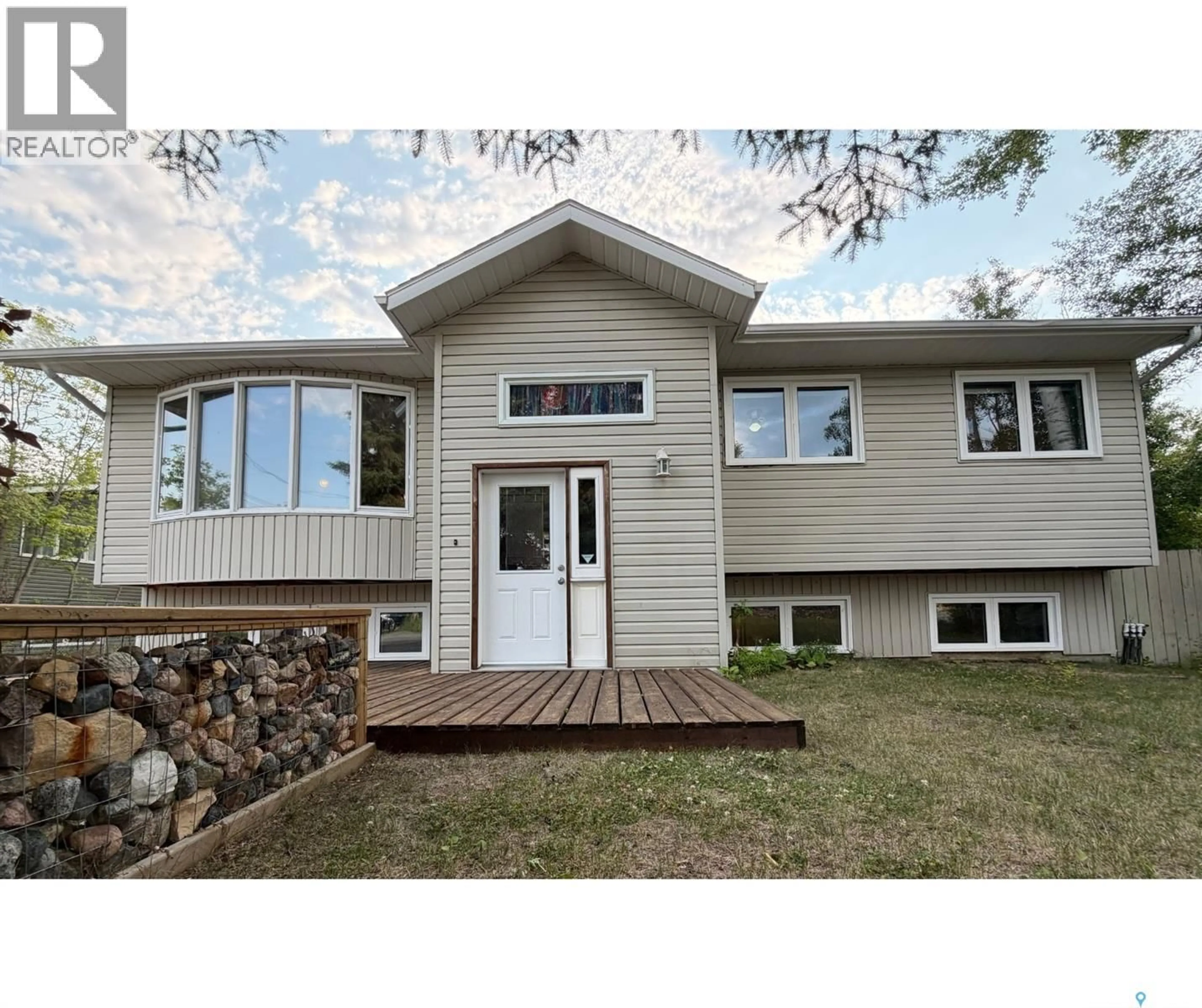 Home with vinyl exterior material, street for 241 DEHAVILLAND AVENUE, Air Ronge Saskatchewan S0J3G0