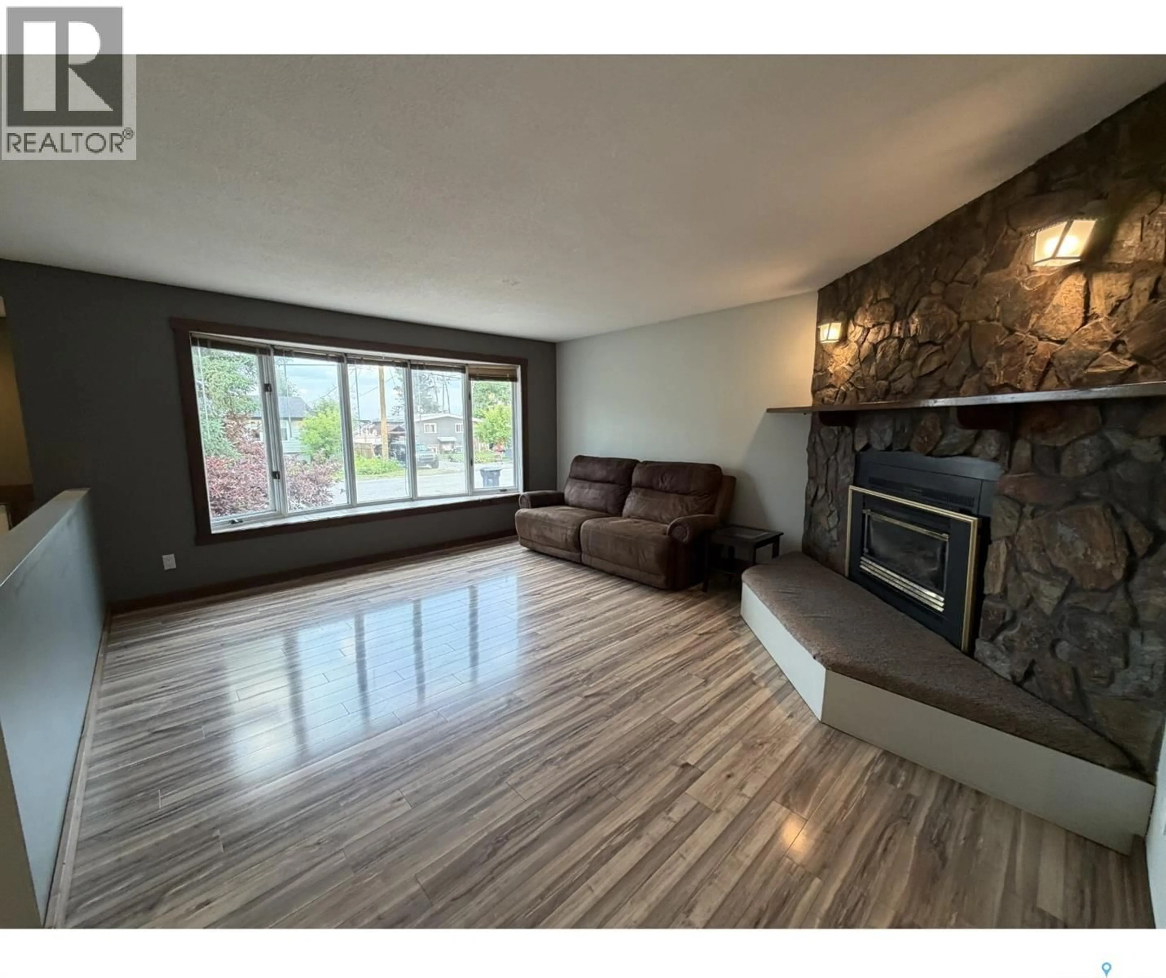 Living room with furniture, wood/laminate floor for 241 DEHAVILLAND AVENUE, Air Ronge Saskatchewan S0J3G0