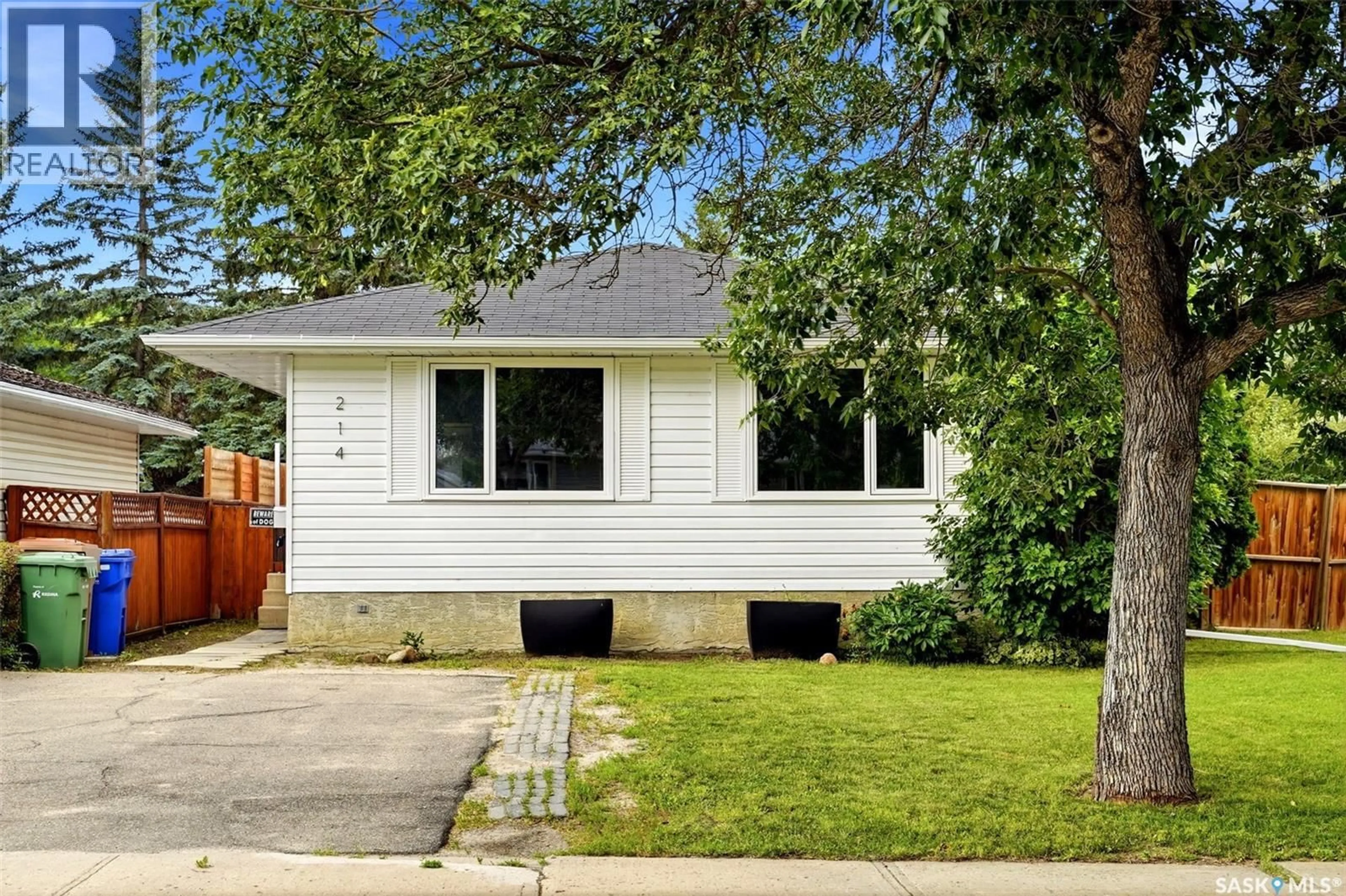 Home with vinyl exterior material, street for 214 CHURCH DRIVE, Regina Saskatchewan S4X1M1