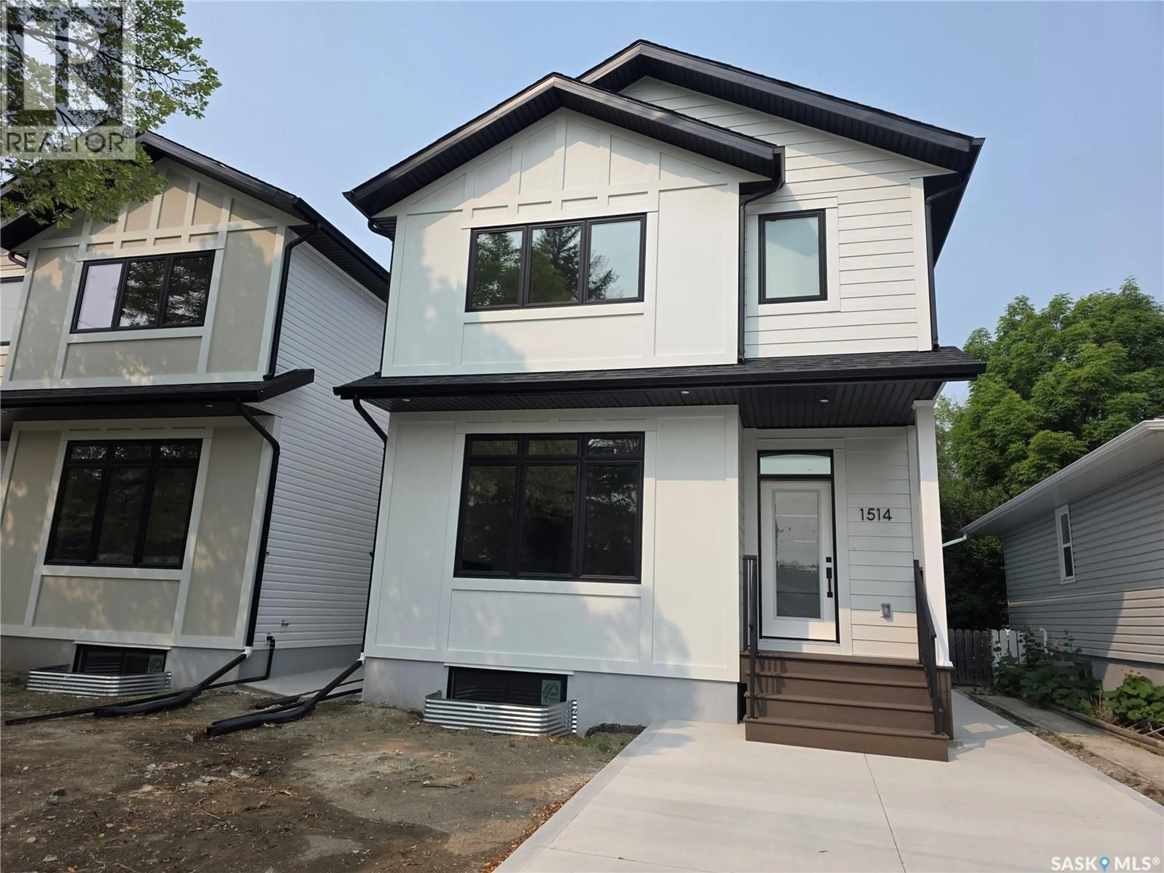 Home with vinyl exterior material, street for 1514 EWART AVENUE, Saskatoon Saskatchewan S7H2K8