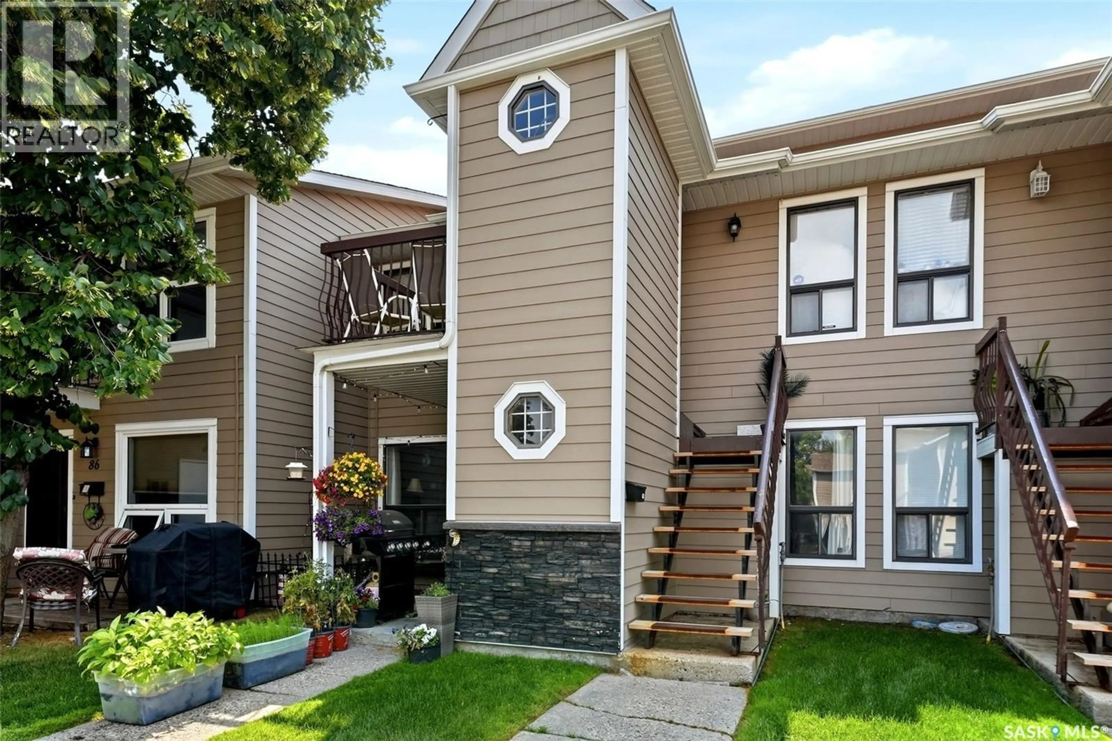 Home with vinyl exterior material, street for 82 CEDAR MEADOW DRIVE, Regina Saskatchewan S4X3J6