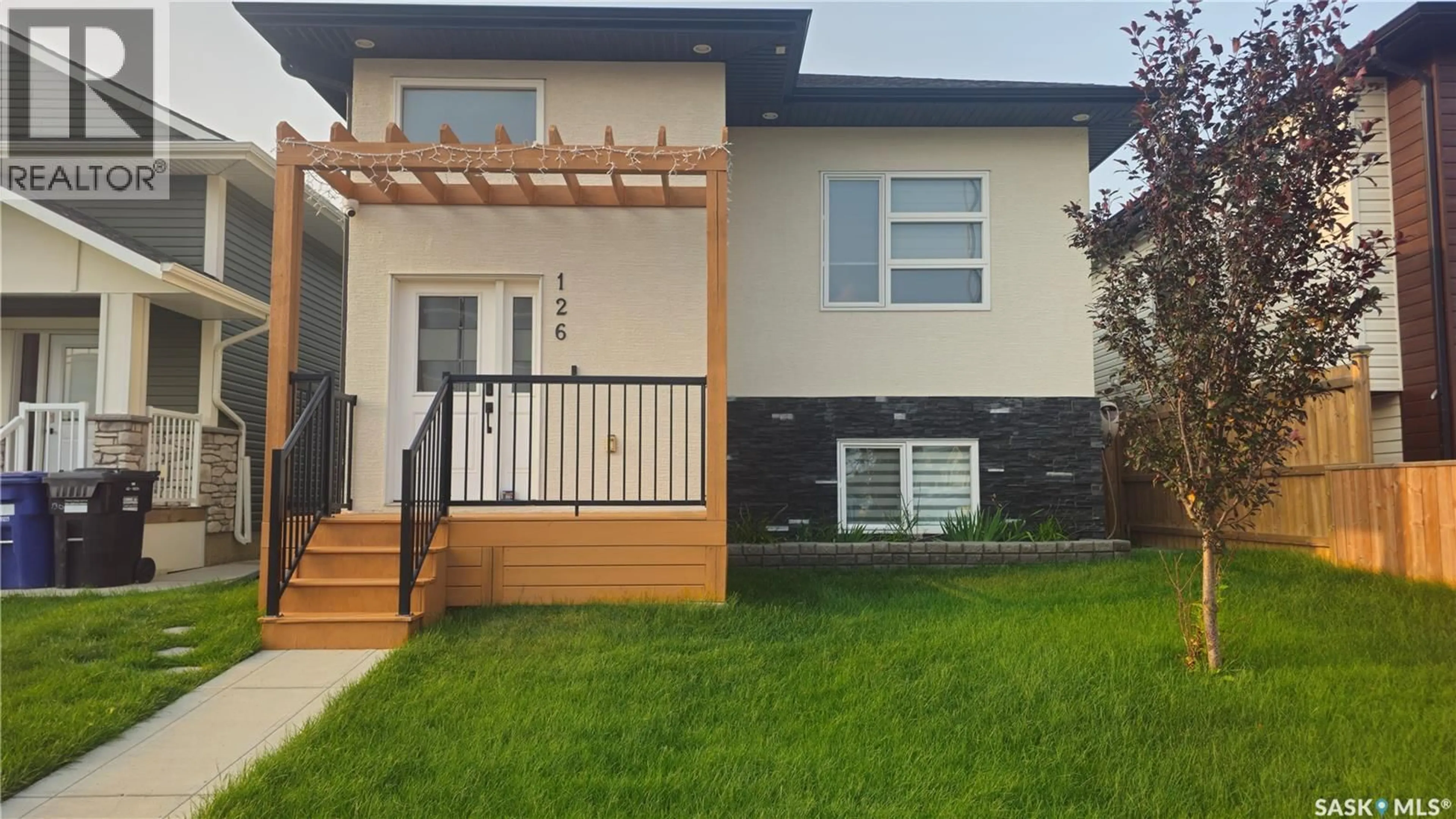 Home with vinyl exterior material, street for 126 BOLSTAD WAY, Saskatoon Saskatchewan S7W0Y1