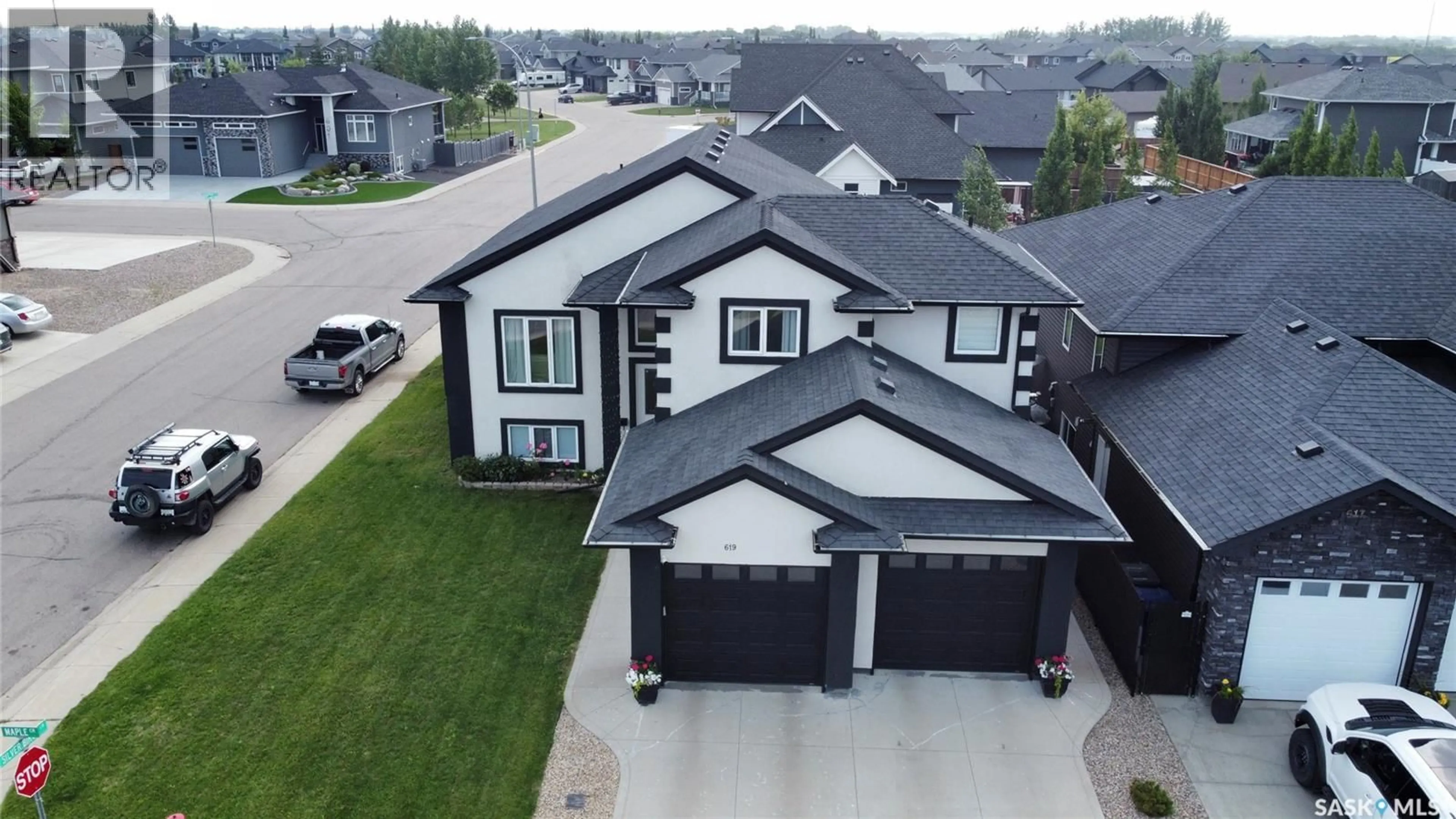 A pic from outside/outdoor area/front of a property/back of a property/a pic from drone, street for 619 MAPLE CRESCENT, Warman Saskatchewan S0K4S0