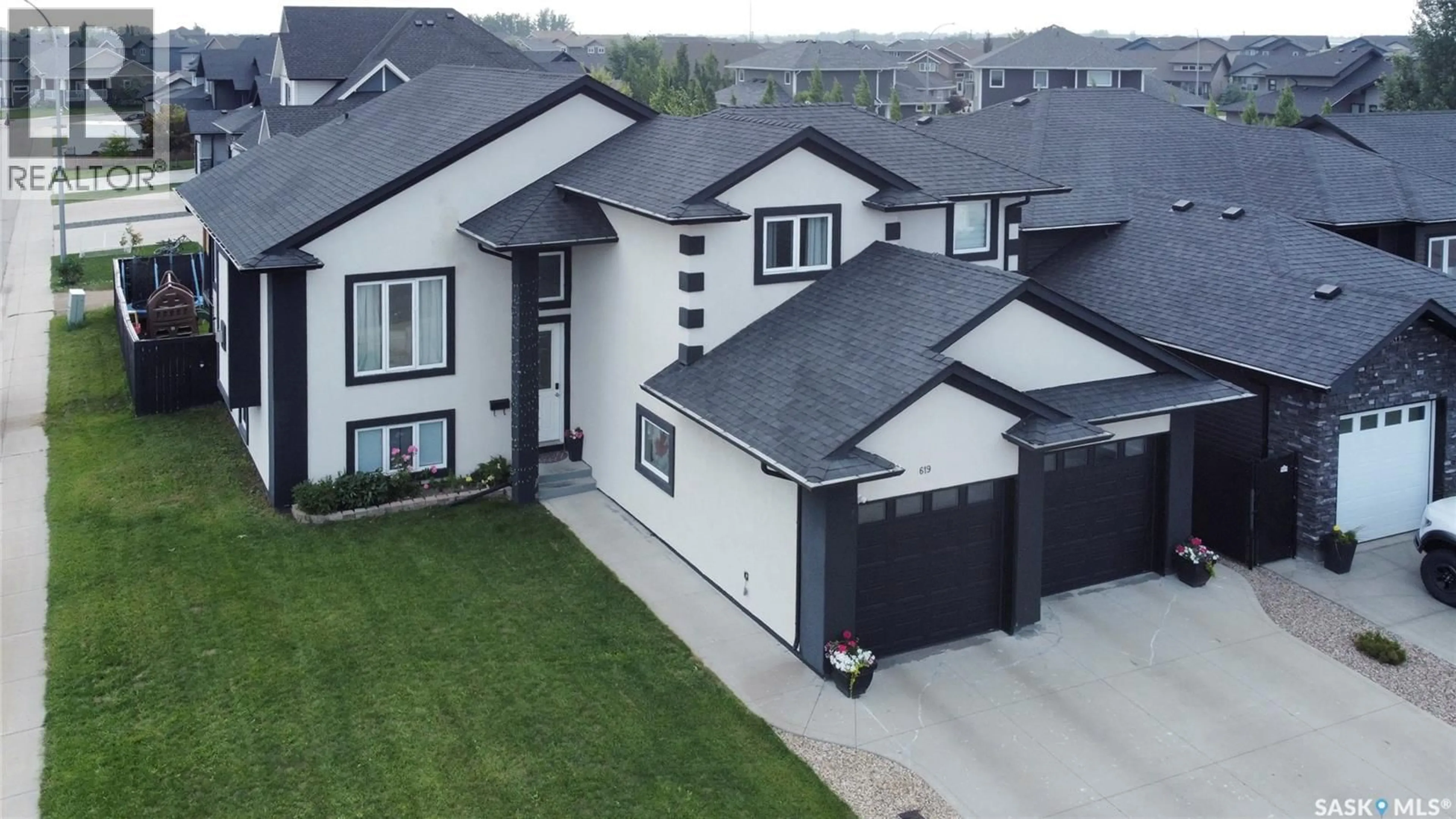 A pic from outside/outdoor area/front of a property/back of a property/a pic from drone, street for 619 MAPLE CRESCENT, Warman Saskatchewan S0K4S0