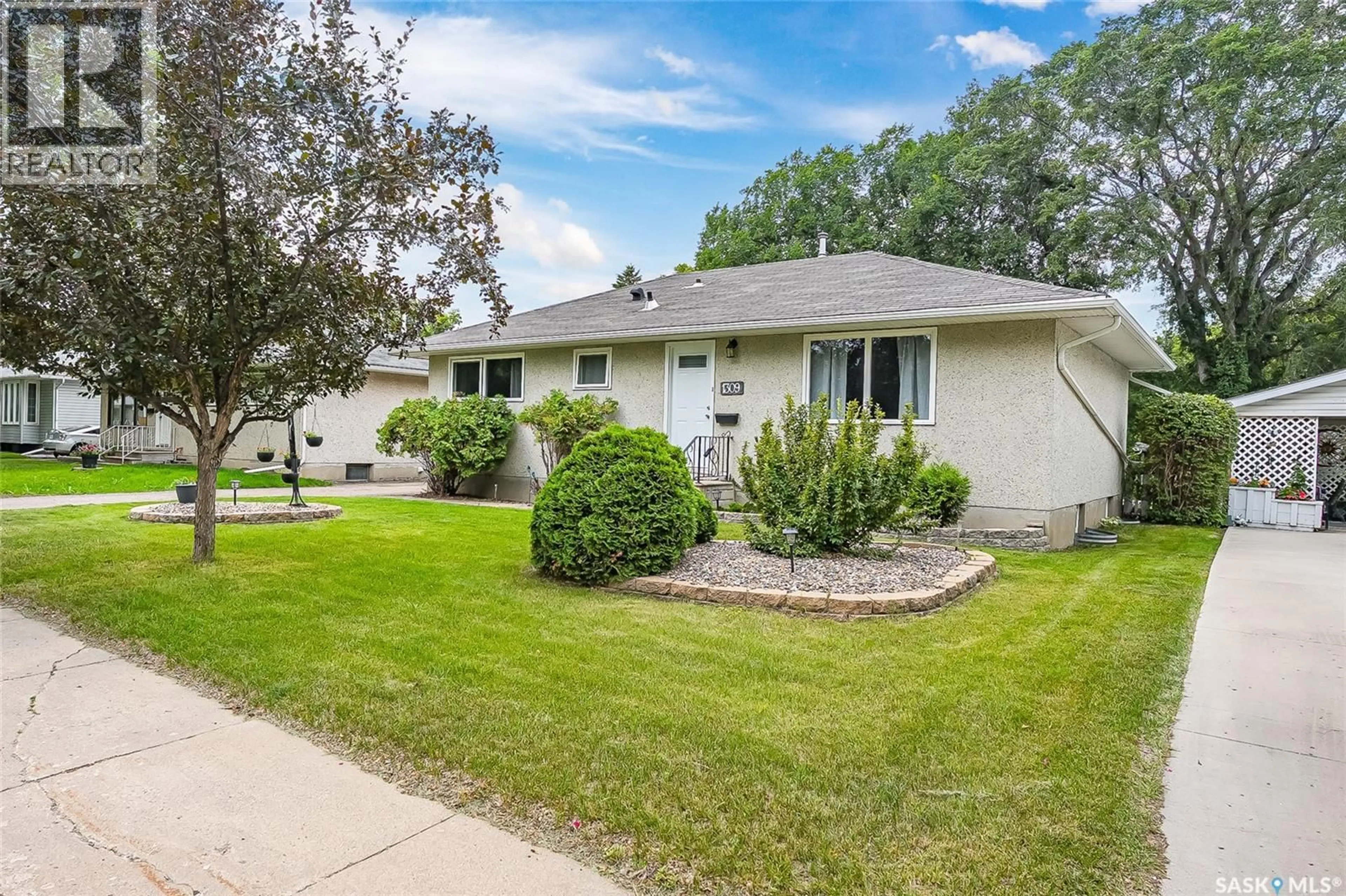 Home with vinyl exterior material, street for 1309 I AVENUE, Saskatoon Saskatchewan S7L2J1
