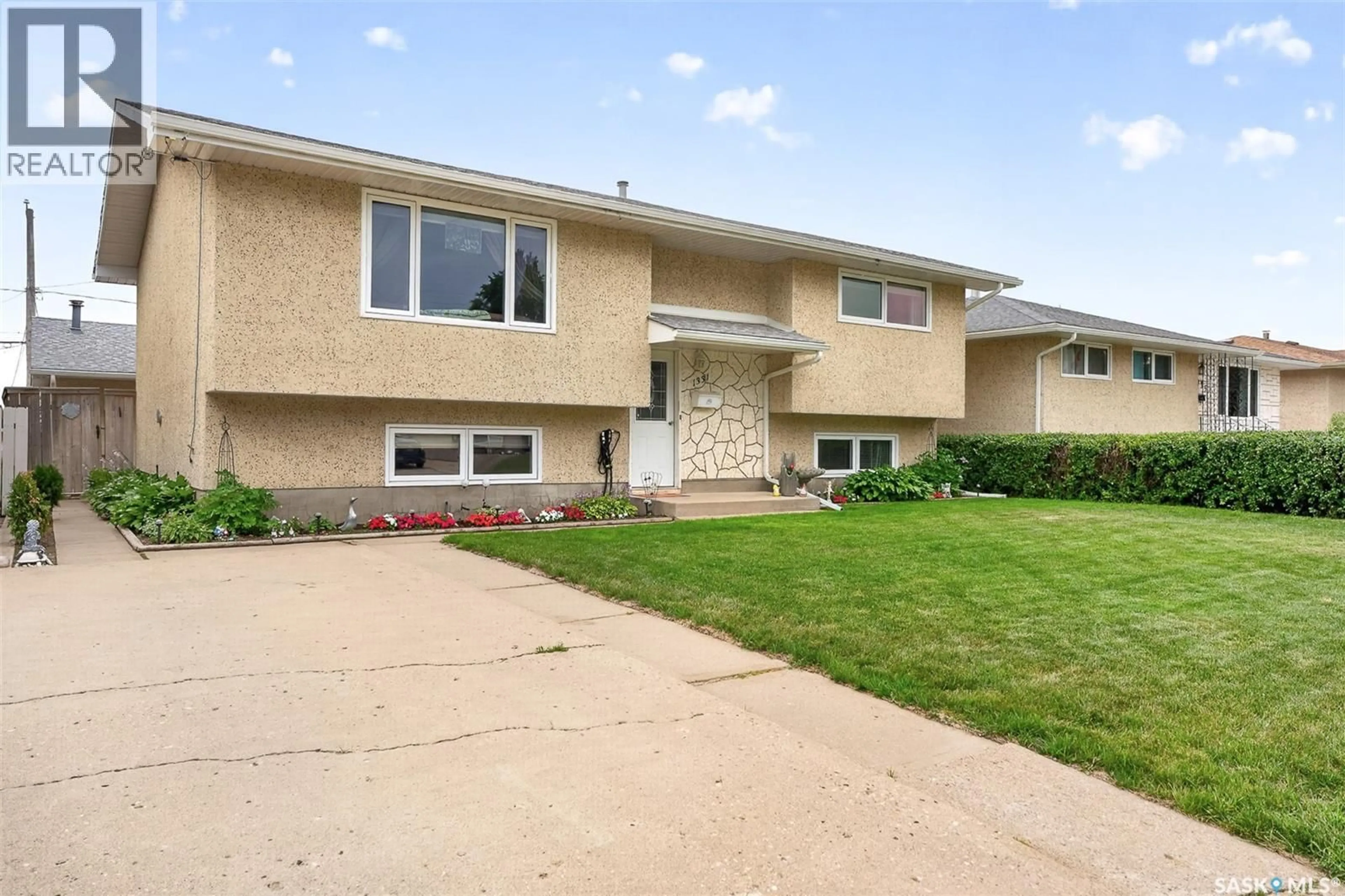 Home with vinyl exterior material, street for 1331 ATHABASCA STREET, Moose Jaw Saskatchewan S6H6C8