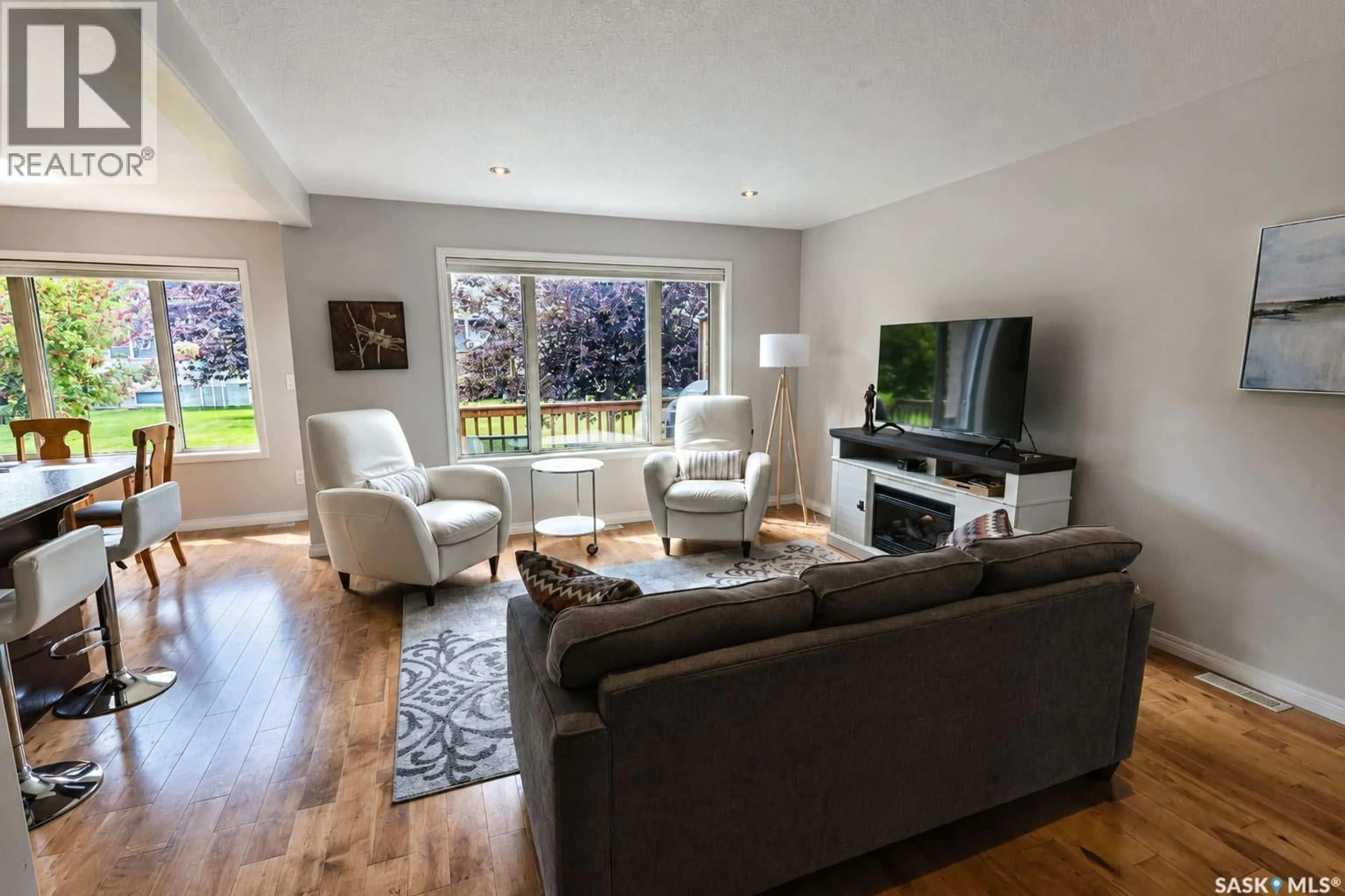 Living room with furniture, wood/laminate floor for 44 1600 MUZZY DRIVE, Prince Albert Saskatchewan S6V0A1