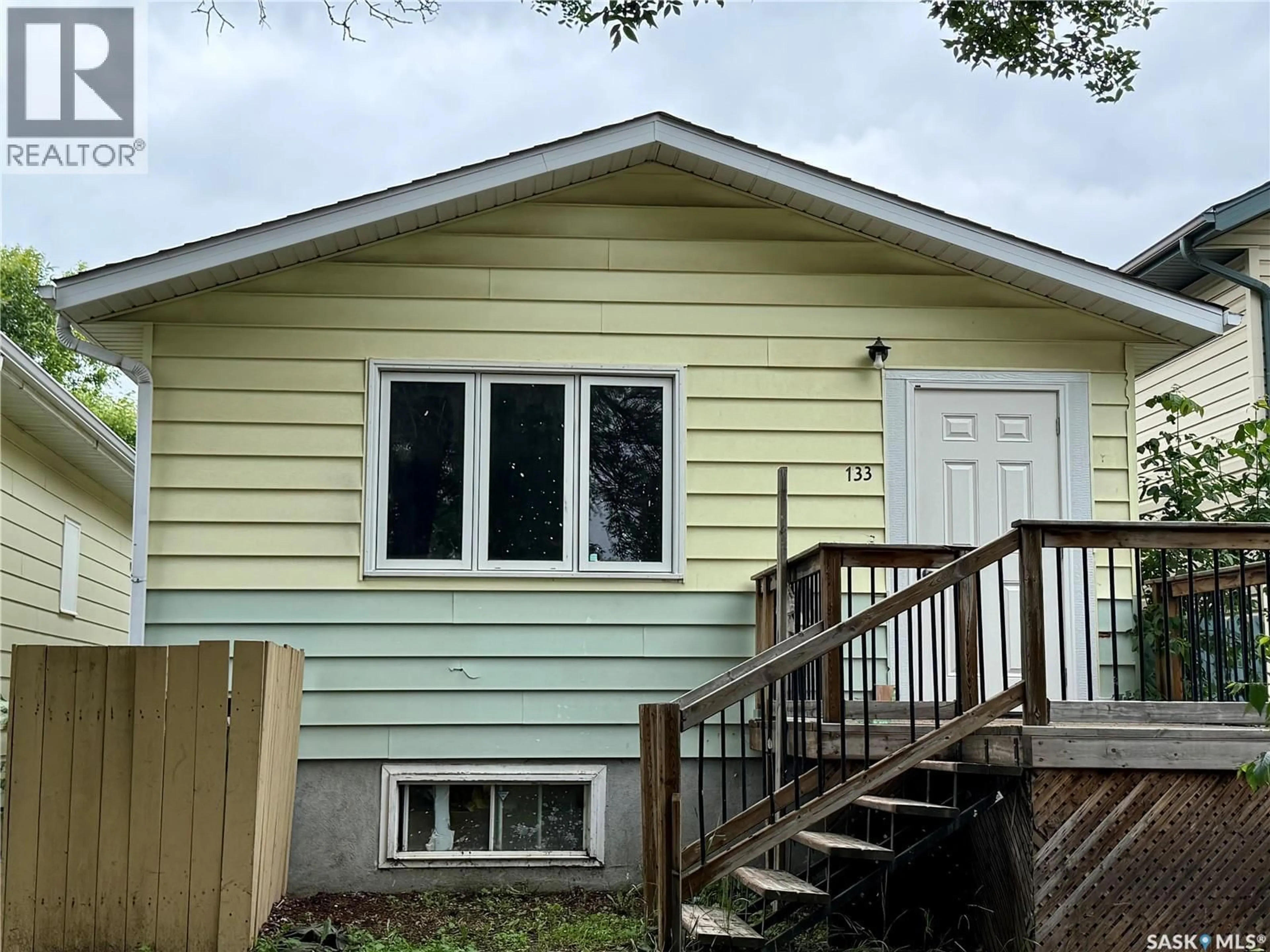 Home with vinyl exterior material, street for 133 L AVENUE, Saskatoon Saskatchewan S7M2G0