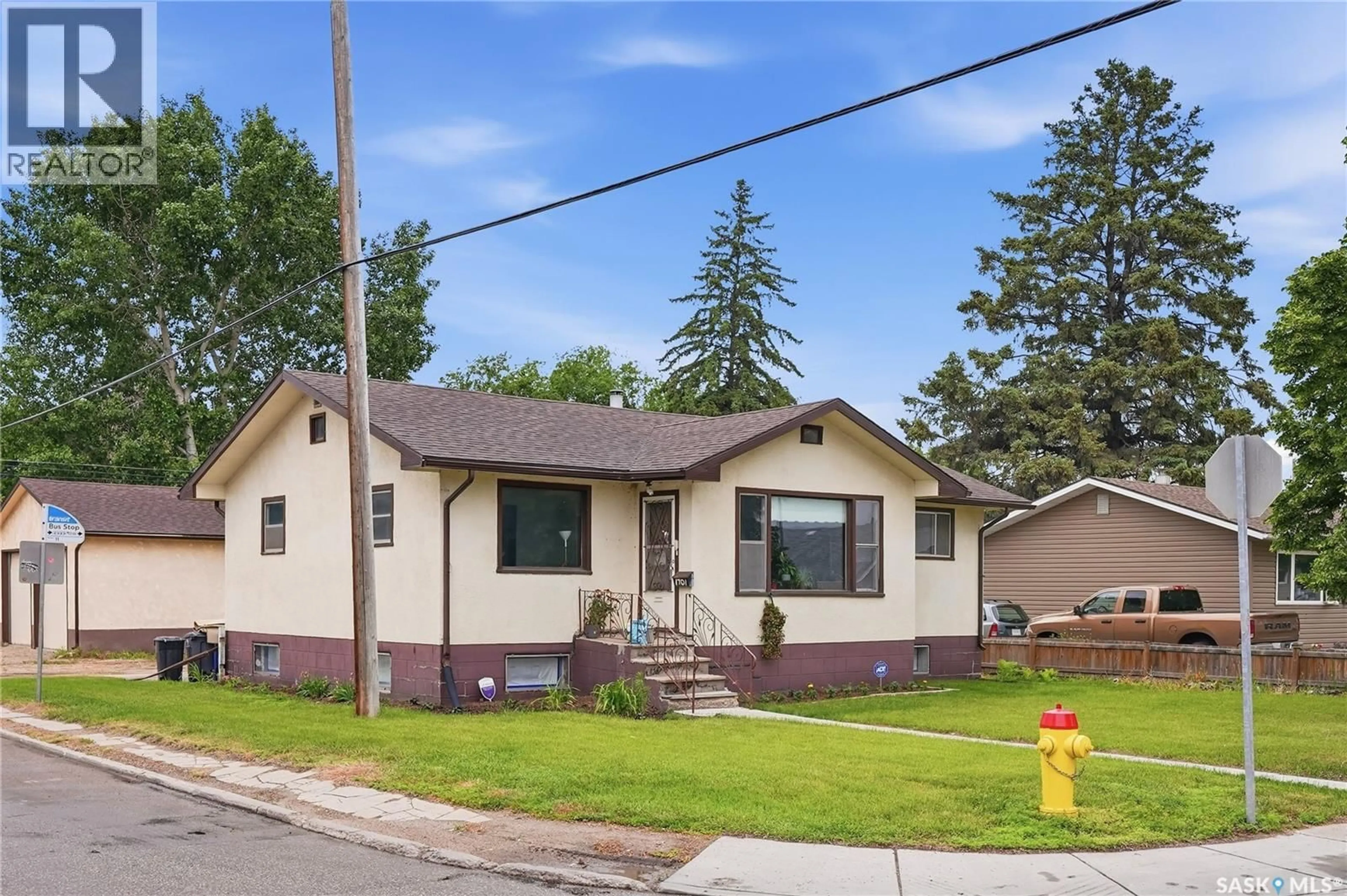 Home with vinyl exterior material, street for 1701 C AVENUE, Saskatoon Saskatchewan S7L1L6