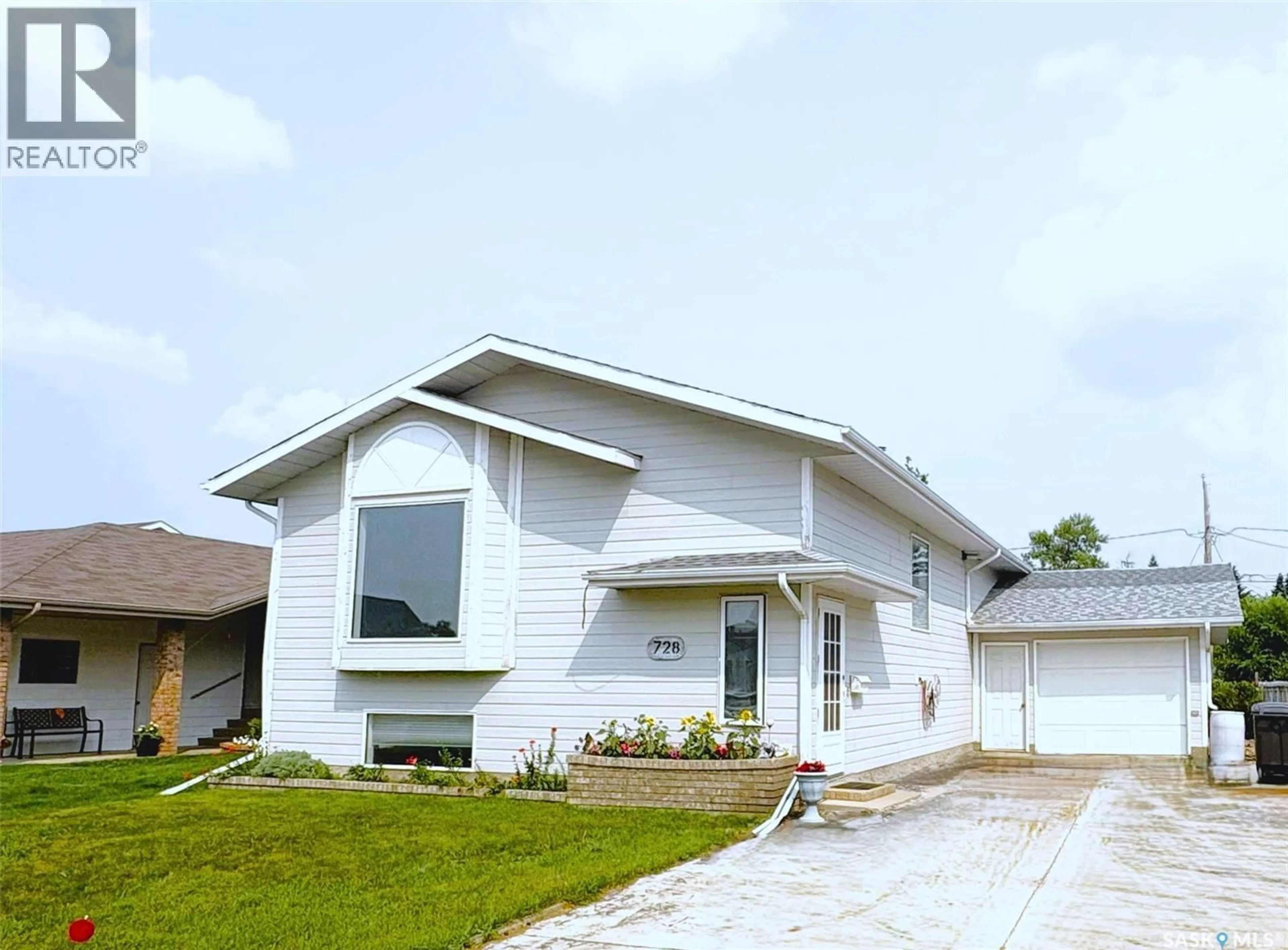 Home with vinyl exterior material, street for 728 14TH STREET, Humboldt Saskatchewan S0K2A0