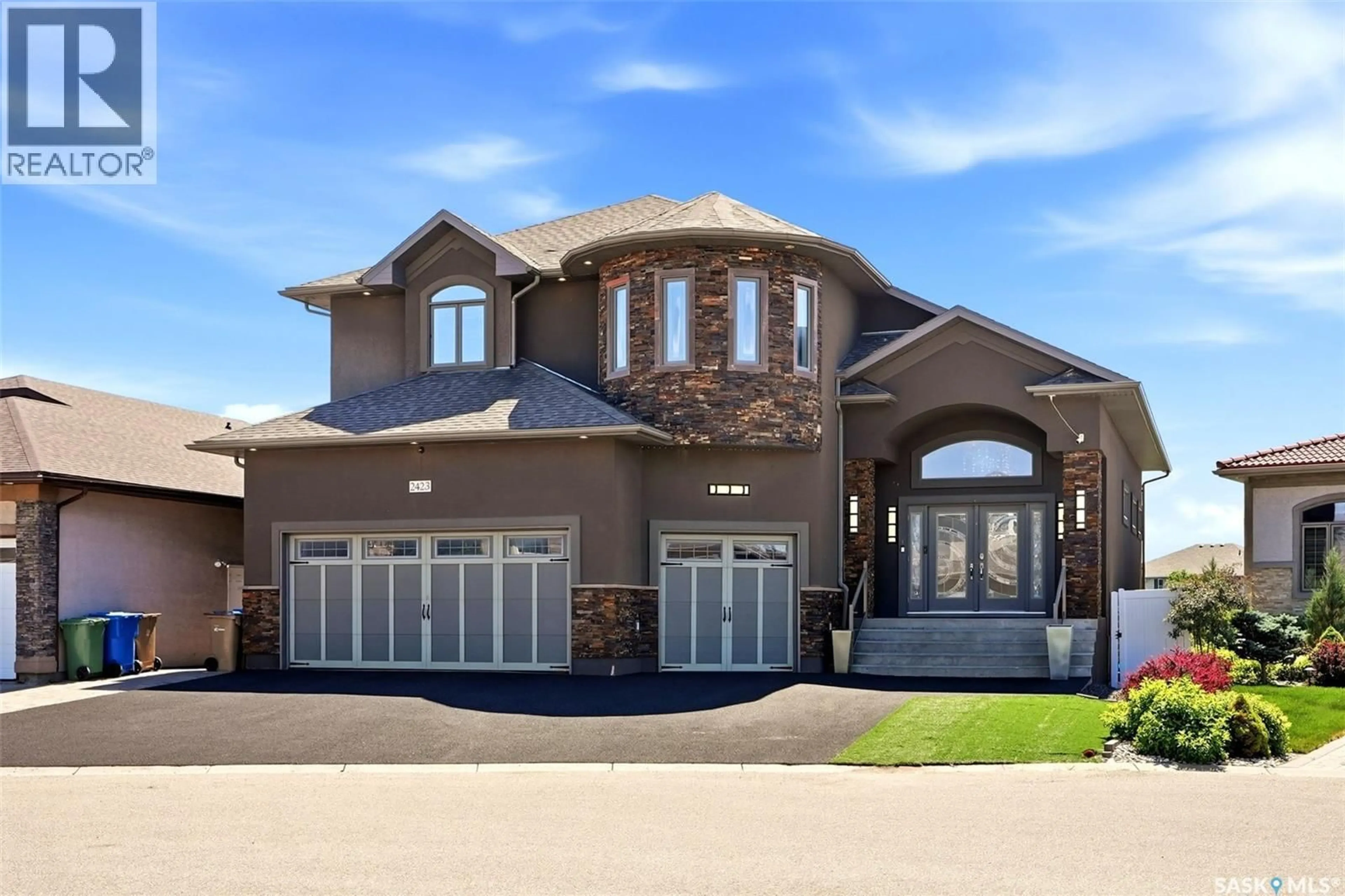 Home with brick exterior material, street for 2423 LINNER BAY, Regina Saskatchewan S4V1K3