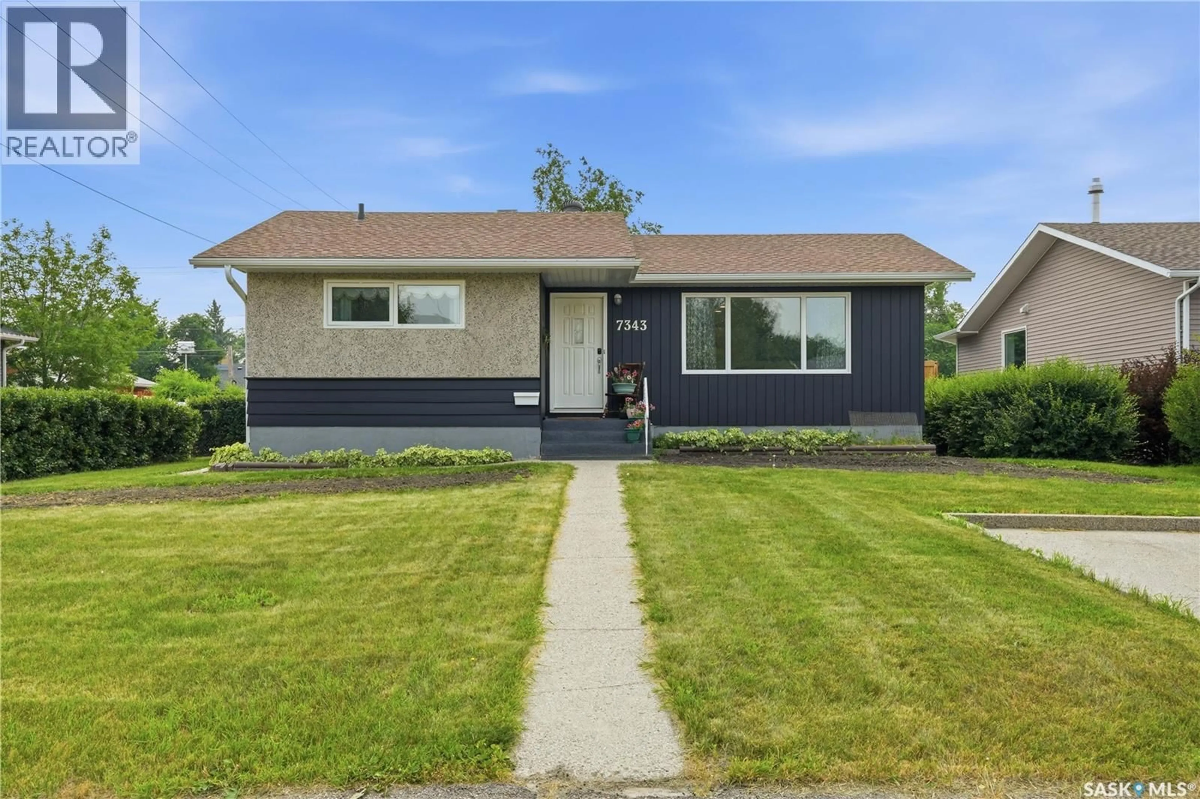 Home with vinyl exterior material, street for 7343 8TH AVENUE, Regina Saskatchewan S4T0X2