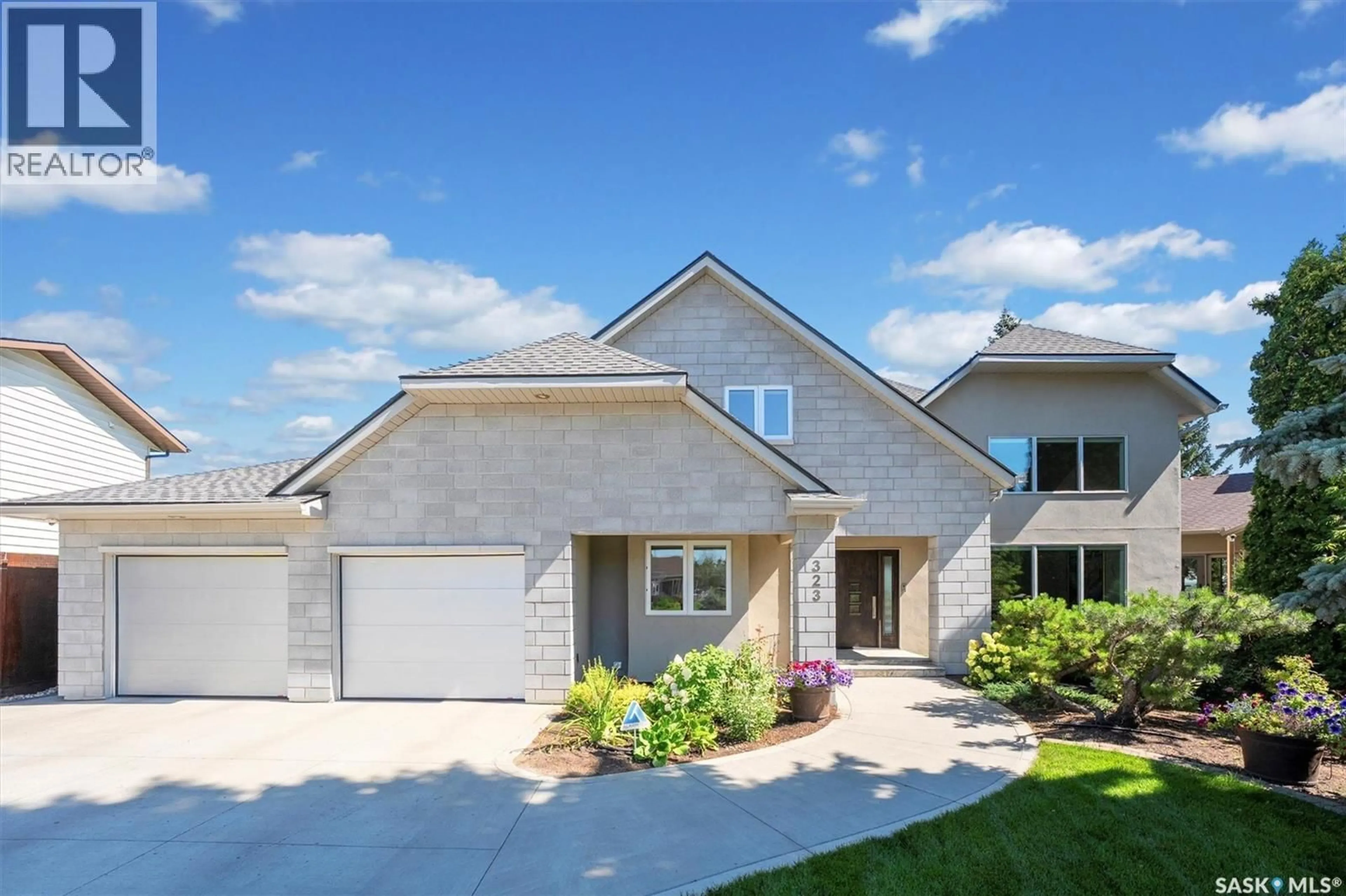 Home with brick exterior material, street for 323 MALLIN CRESCENT, Saskatoon Saskatchewan S7K7X2