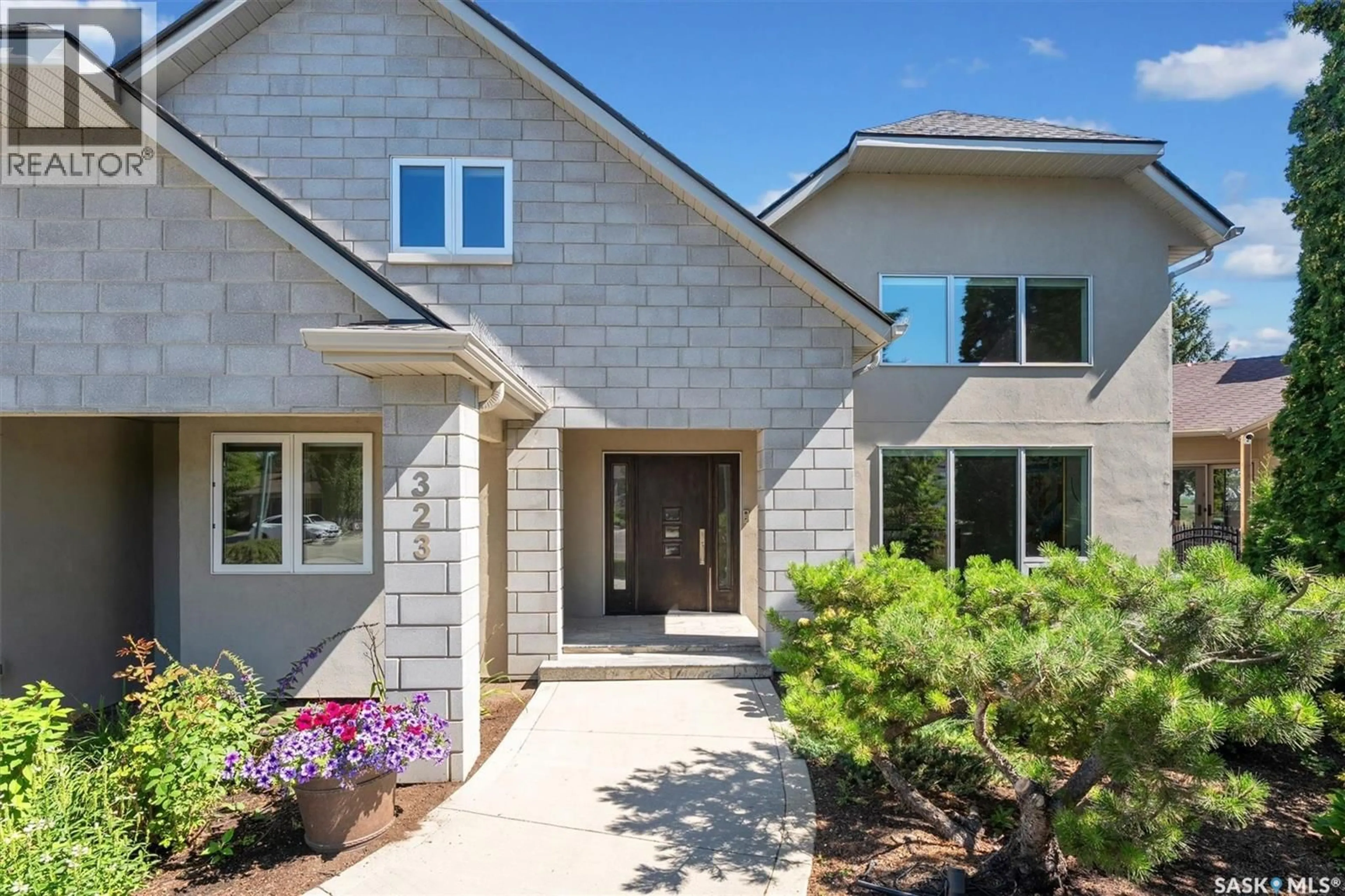 Home with brick exterior material, street for 323 MALLIN CRESCENT, Saskatoon Saskatchewan S7K7X2