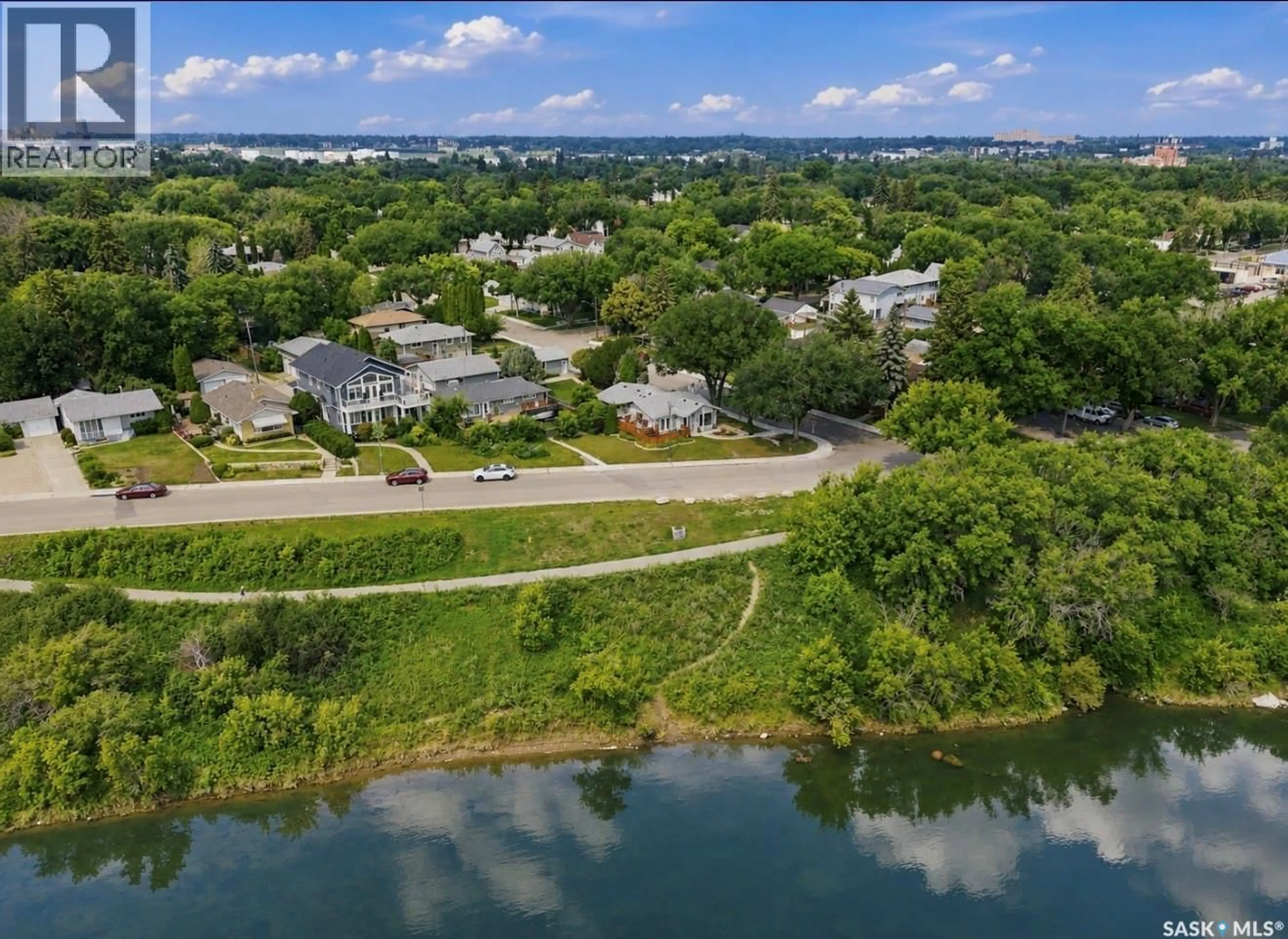 A pic from outside/outdoor area/front of a property/back of a property/a pic from drone, water/lake/river/ocean view for 1201 SPADINA CRESCENT, Saskatoon Saskatchewan S7M1P4