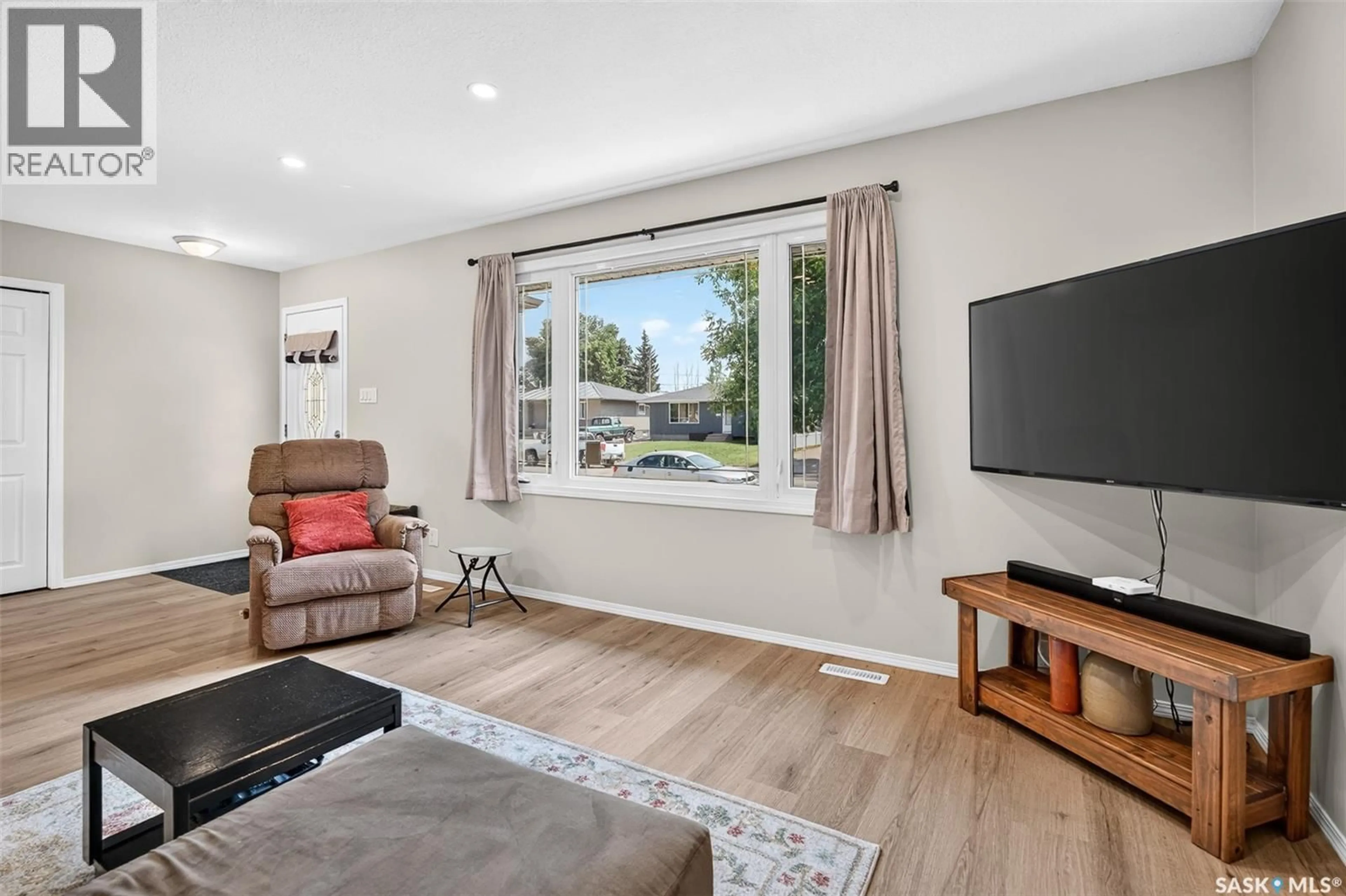 Living room with furniture, wood/laminate floor for 1314 VAUGHAN STREET, Moose Jaw Saskatchewan S6H5P7