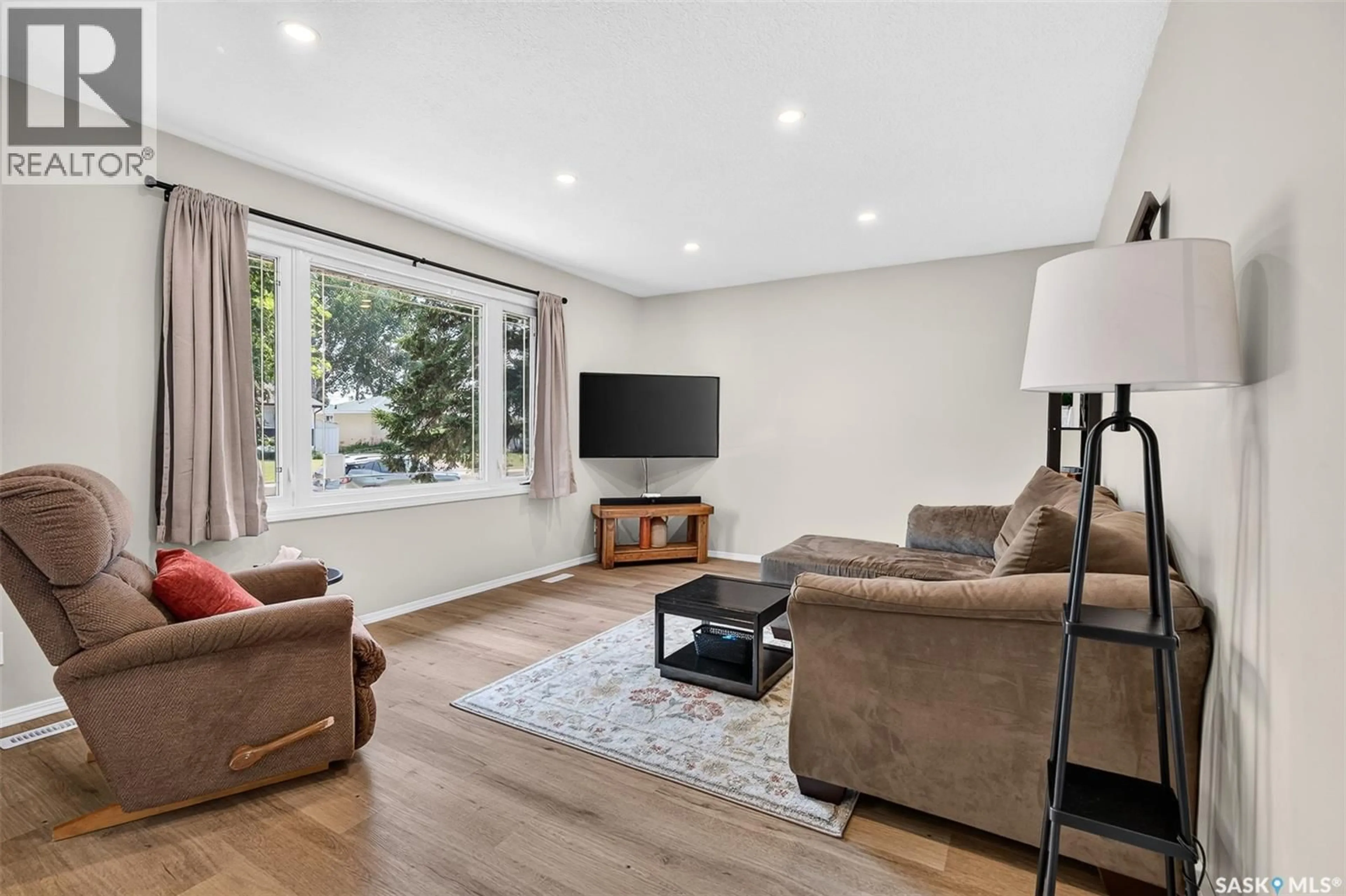 Living room with furniture, wood/laminate floor for 1314 VAUGHAN STREET, Moose Jaw Saskatchewan S6H5P7