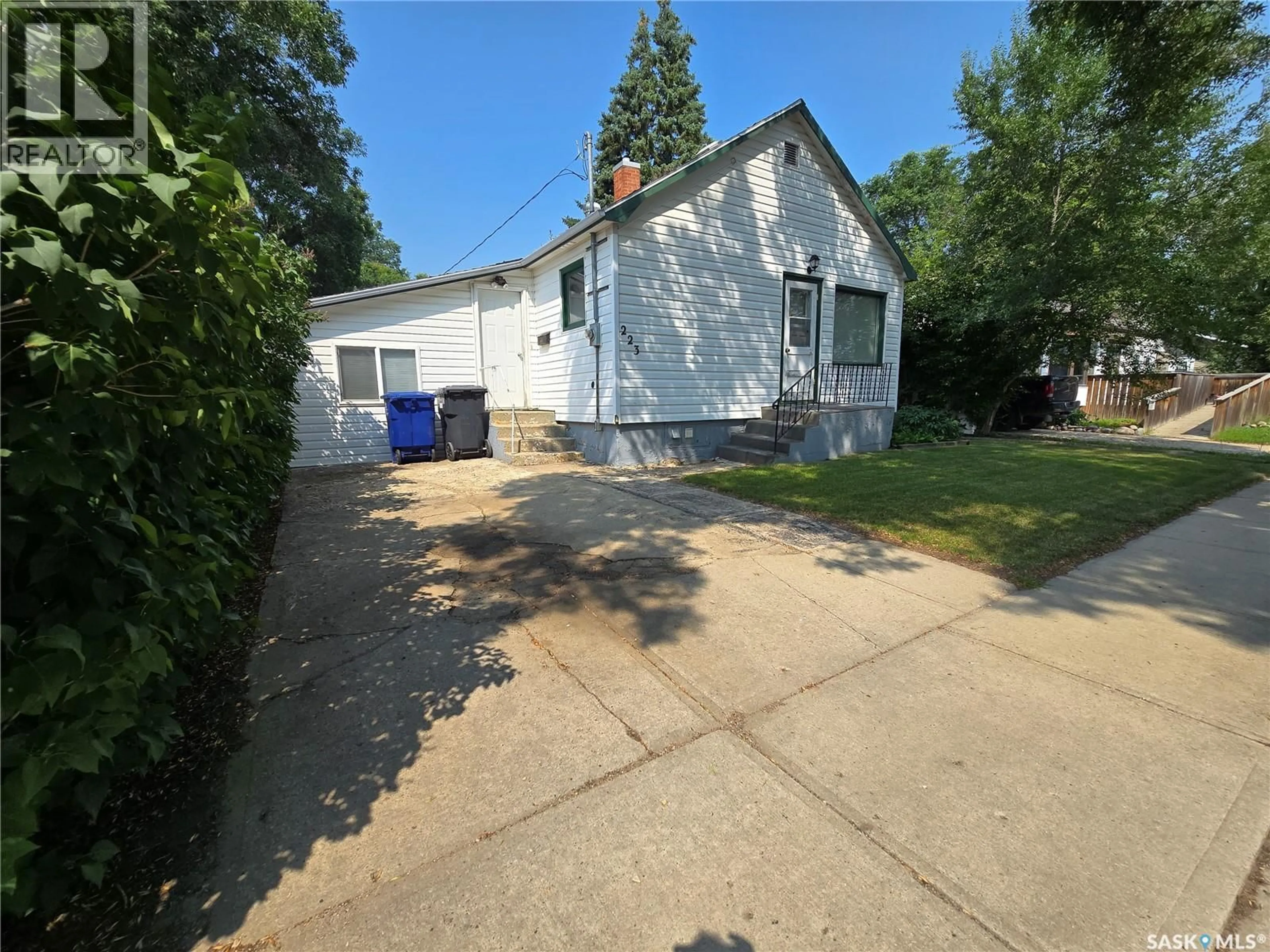 A pic from outside/outdoor area/front of a property/back of a property/a pic from drone, street for 223 9TH STREET, Weyburn Saskatchewan S4H1E9