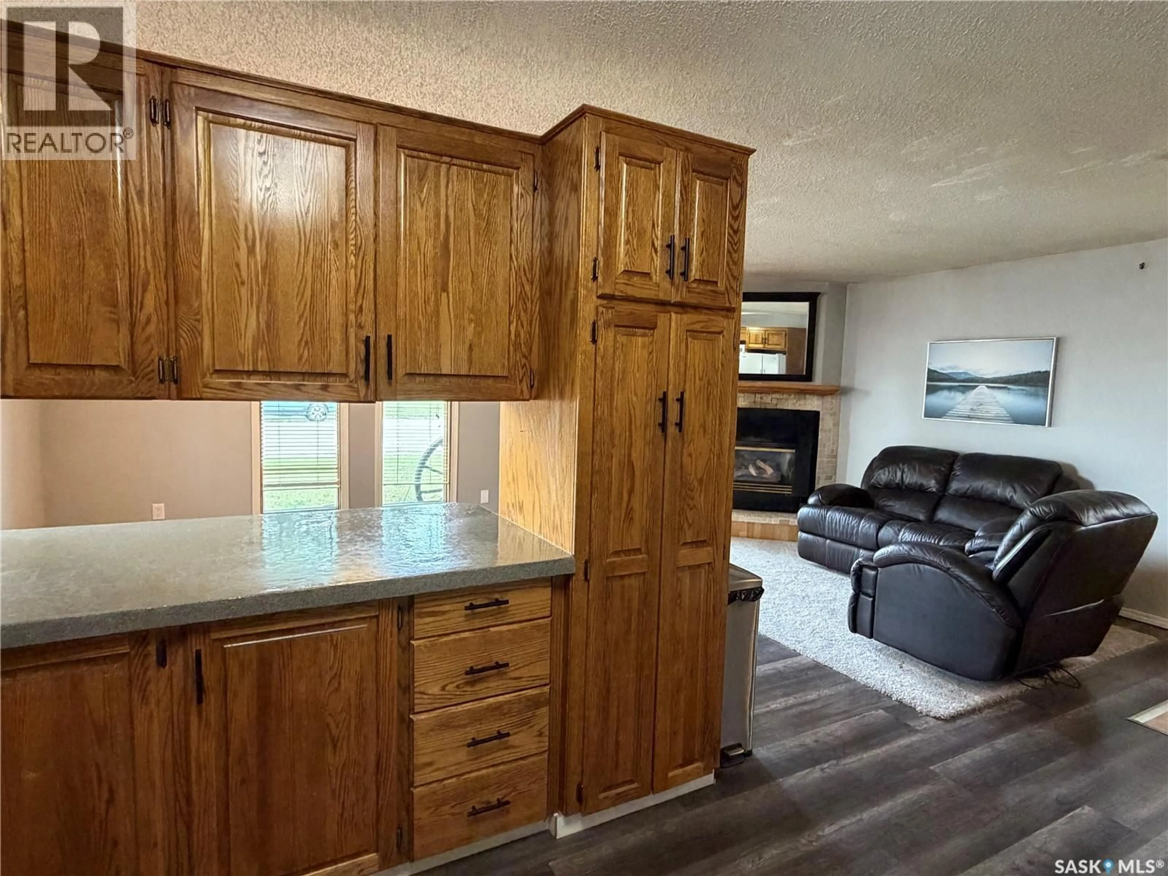 Open concept kitchen, wood/laminate floor for 202 1ST STREET, Turtleford Saskatchewan S0M2Y0