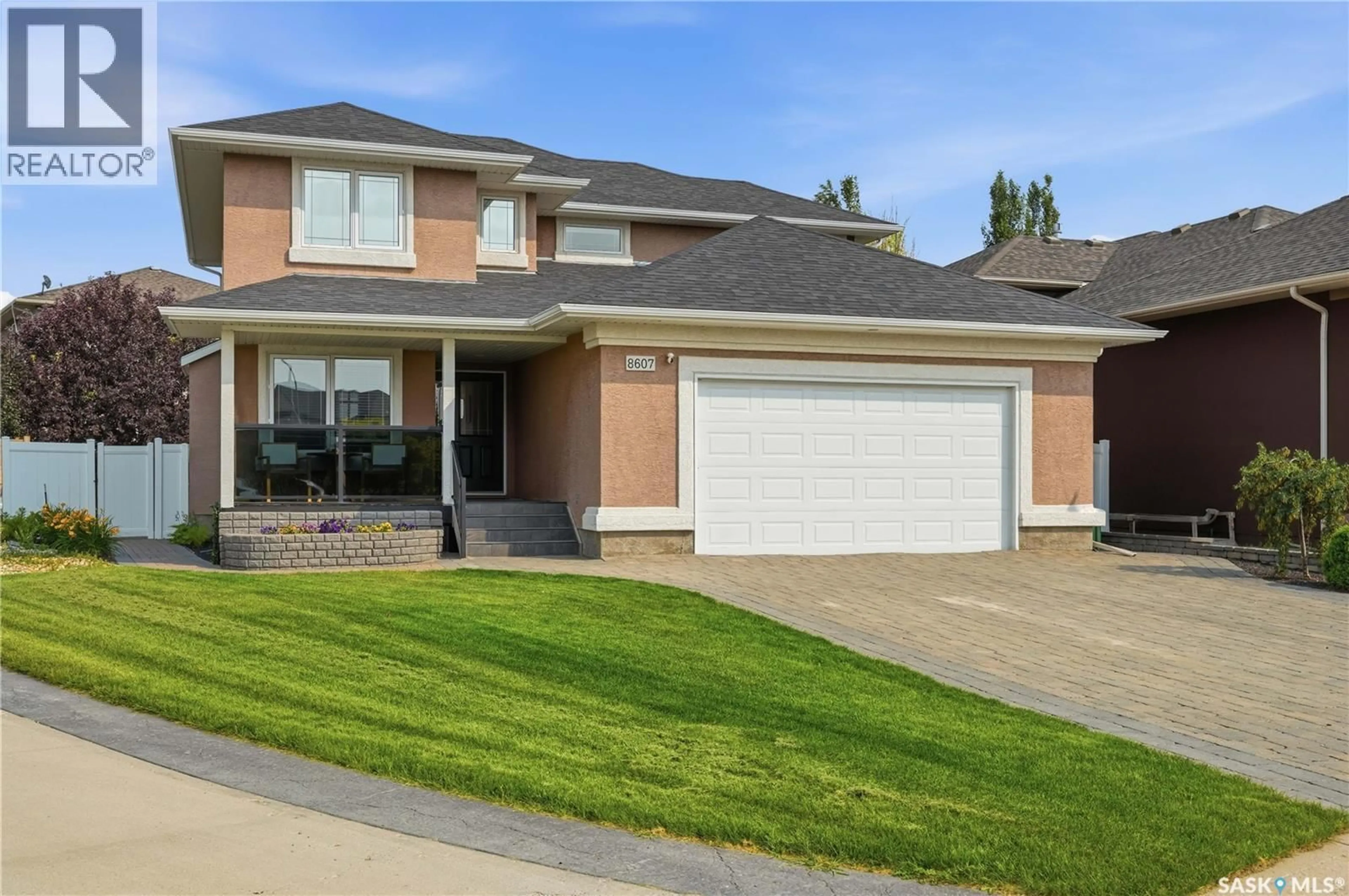 Home with brick exterior material, street for 8607 WASCANA GARDENS LANE, Regina Saskatchewan S4V1G1