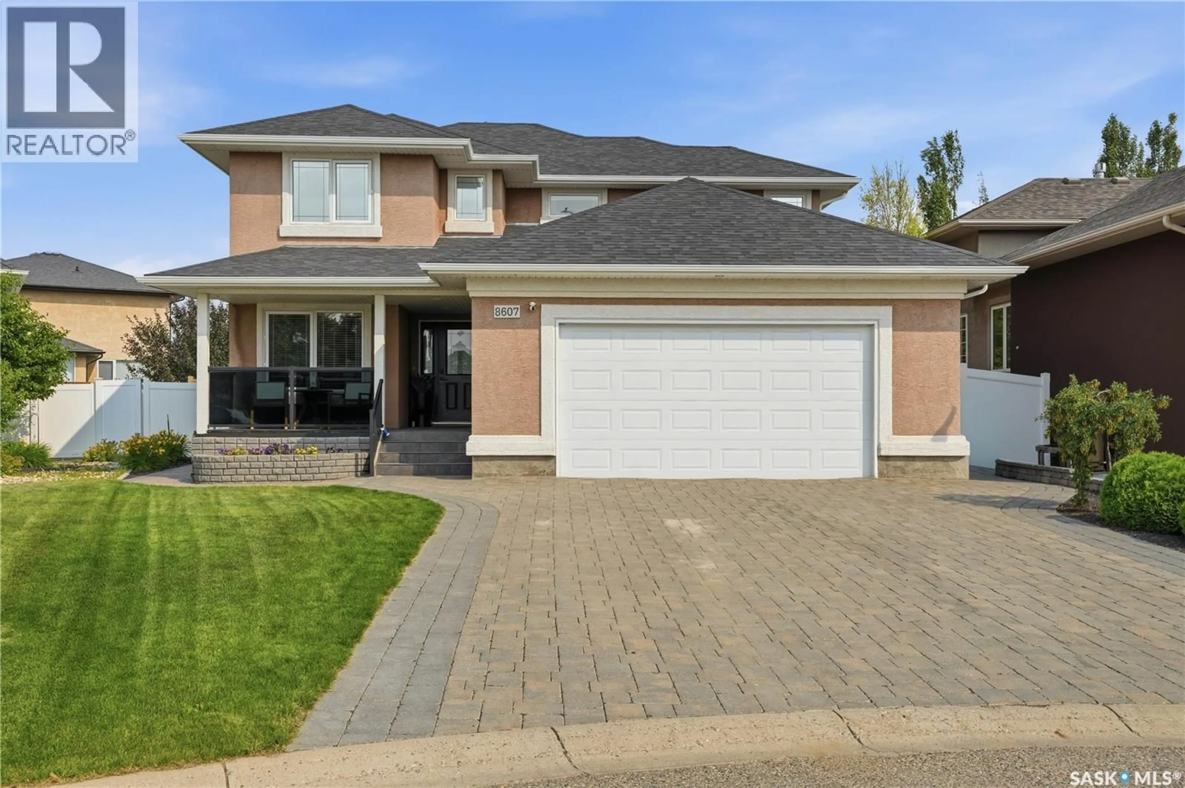 Home with brick exterior material, street for 8607 WASCANA GARDENS LANE, Regina Saskatchewan S4V1G1