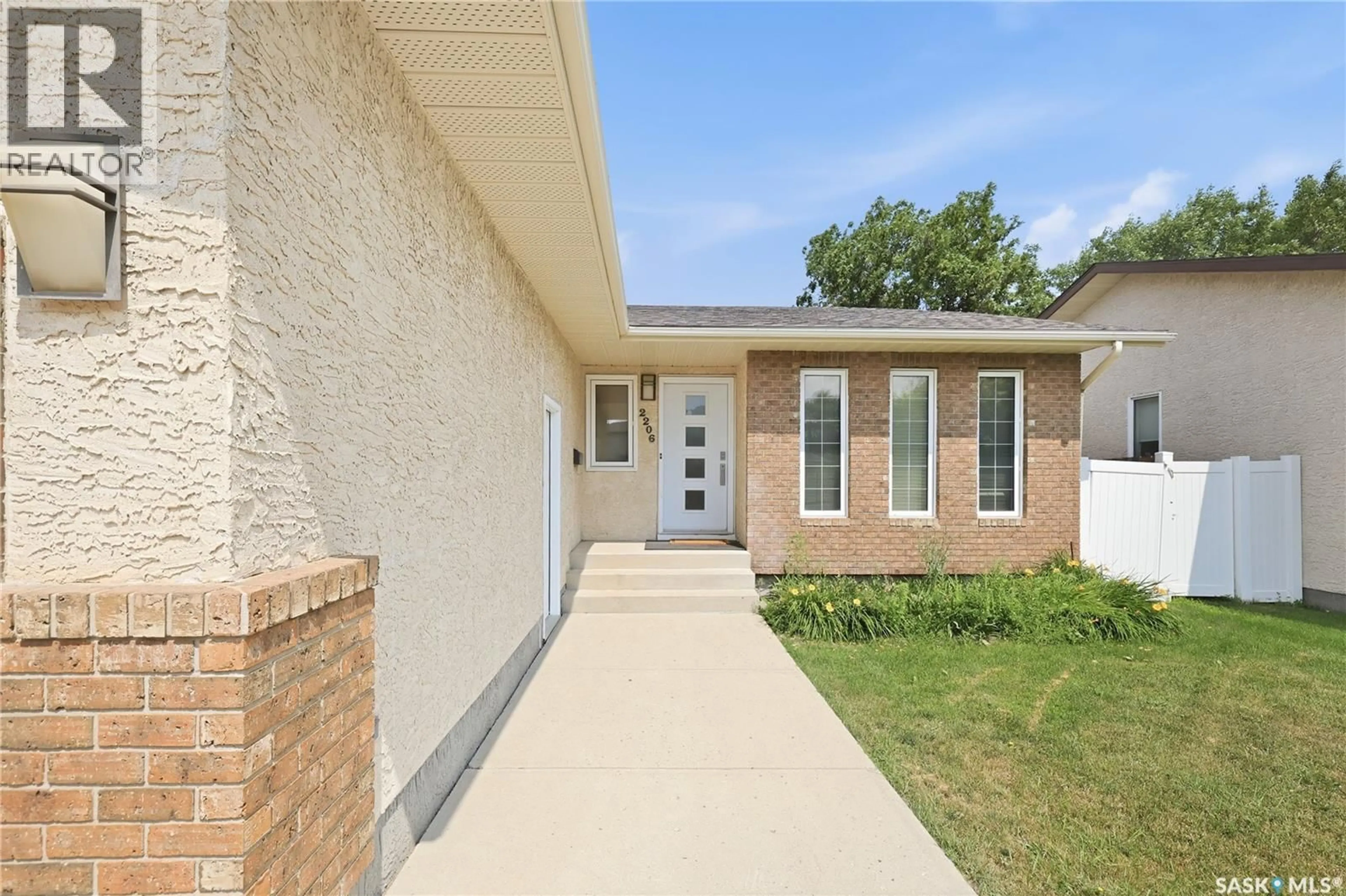 Home with brick exterior material, street for 2206 ASSINIBOINE AVENUE, Regina Saskatchewan S4V2E8
