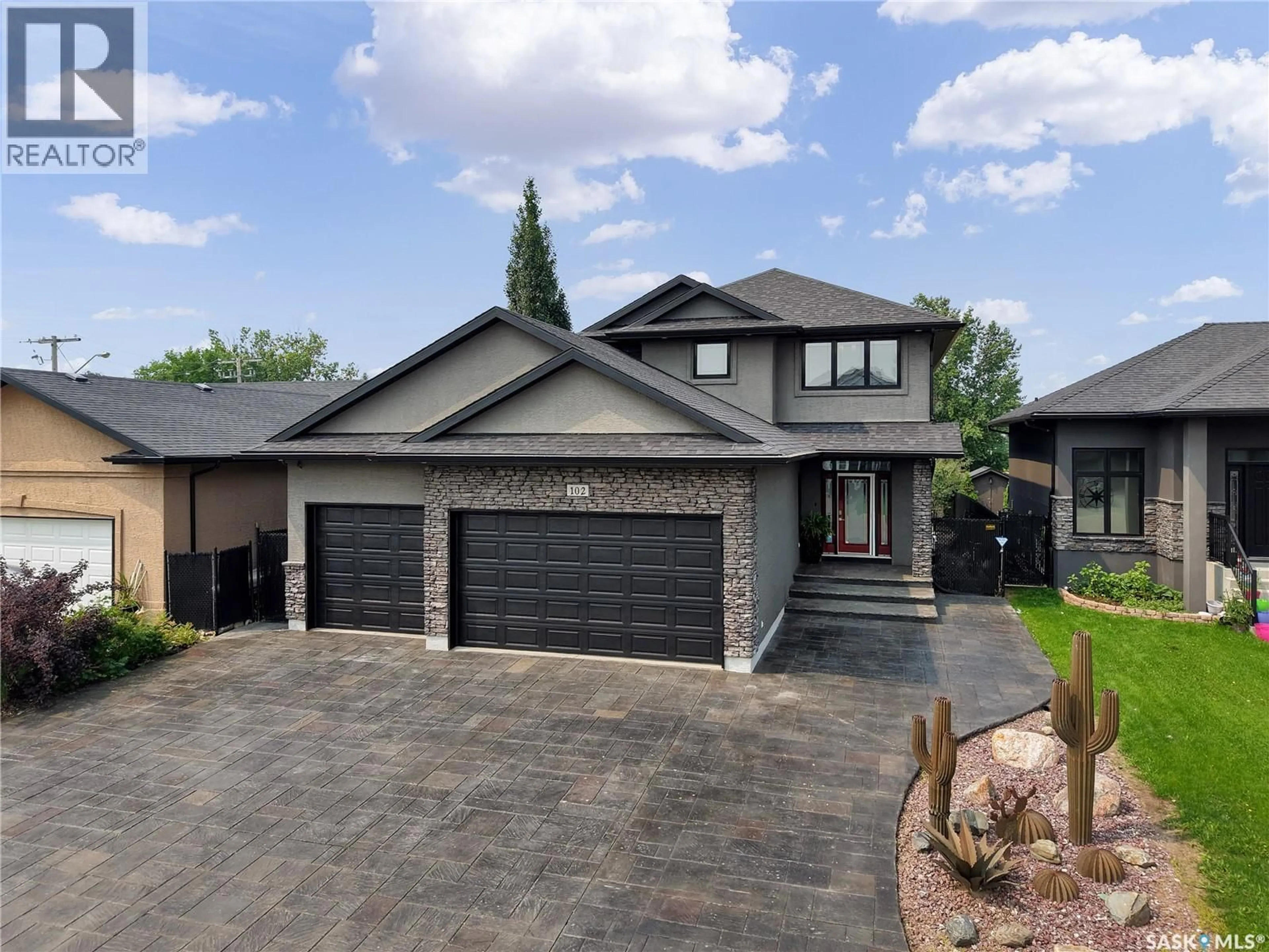 Home with brick exterior material, street for 102 KINSMEN CRESCENT, Martensville Saskatchewan S0K0A2