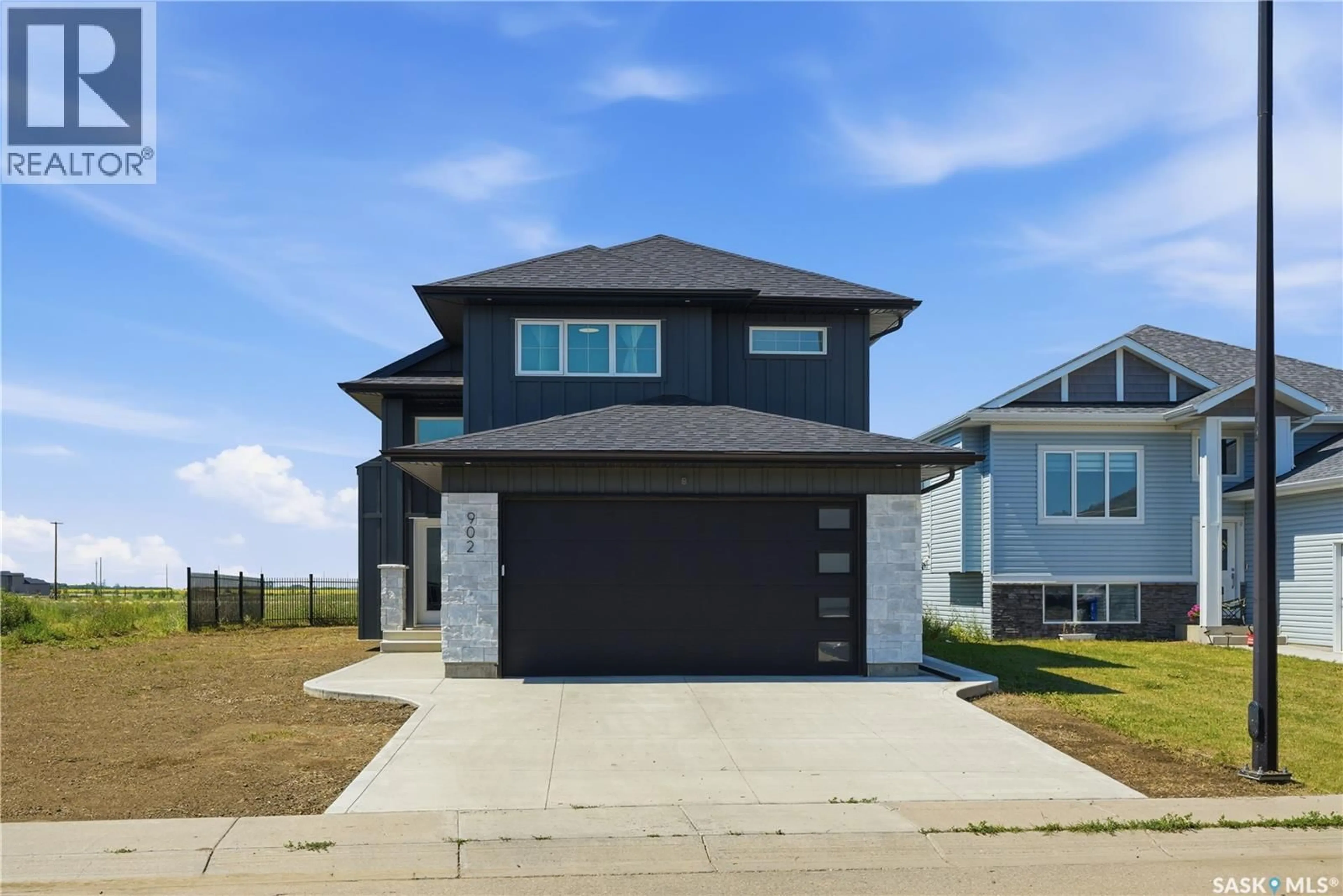 Home with brick exterior material, street for 902 BENTLEY MANOR, Saskatoon Saskatchewan S7L6P4