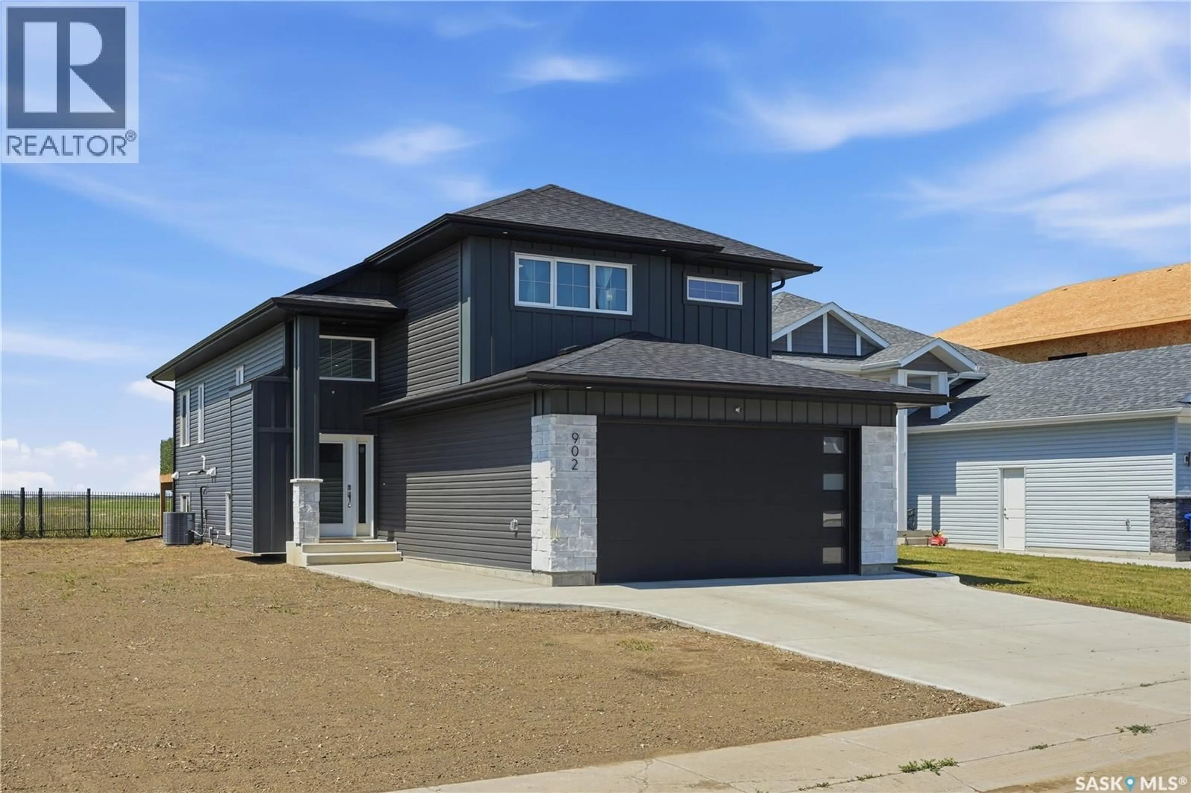 Home with brick exterior material, street for 902 BENTLEY MANOR, Saskatoon Saskatchewan S7L6P4