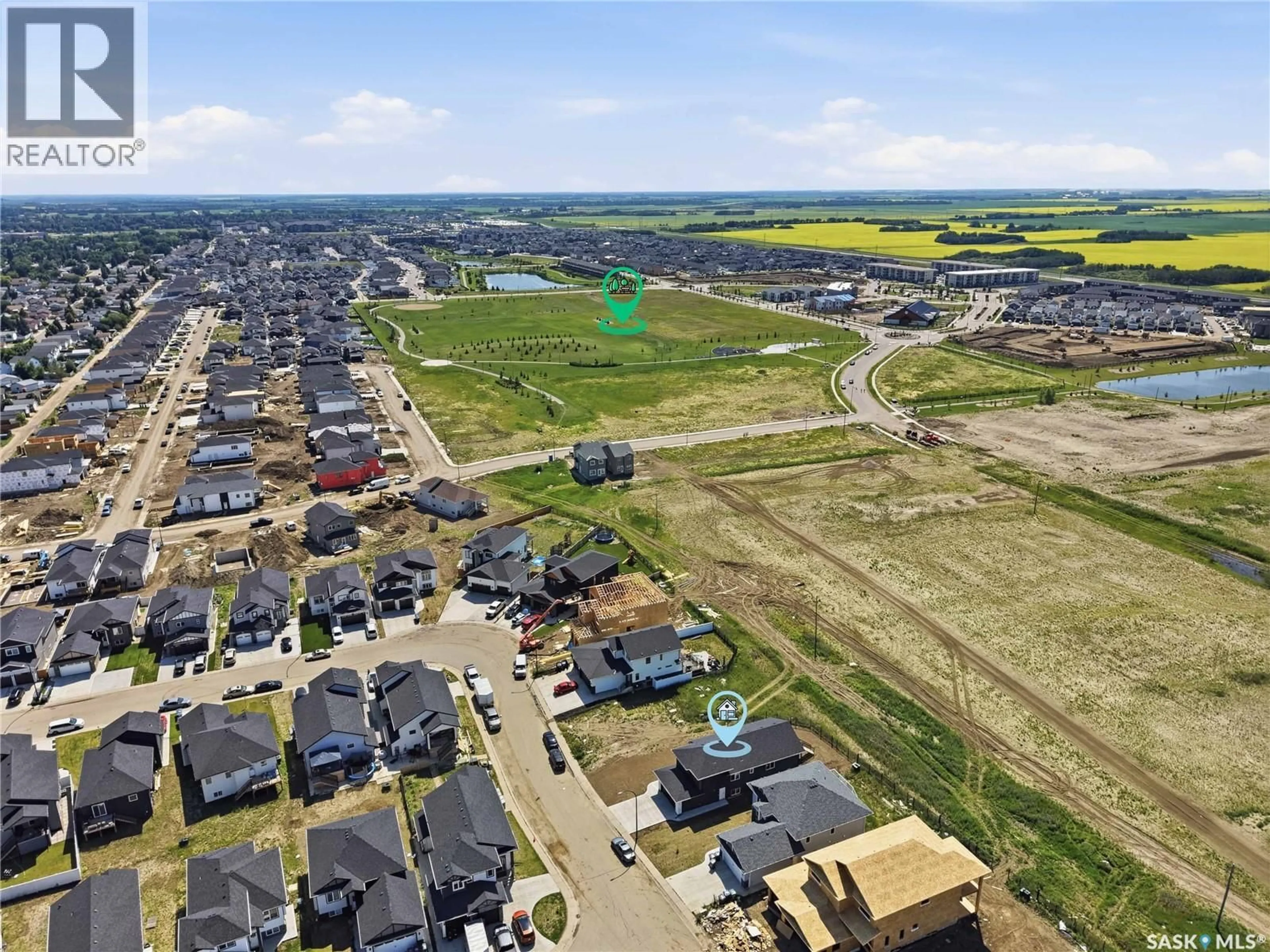 A pic from outside/outdoor area/front of a property/back of a property/a pic from drone, street for 902 BENTLEY MANOR, Saskatoon Saskatchewan S7L6P4