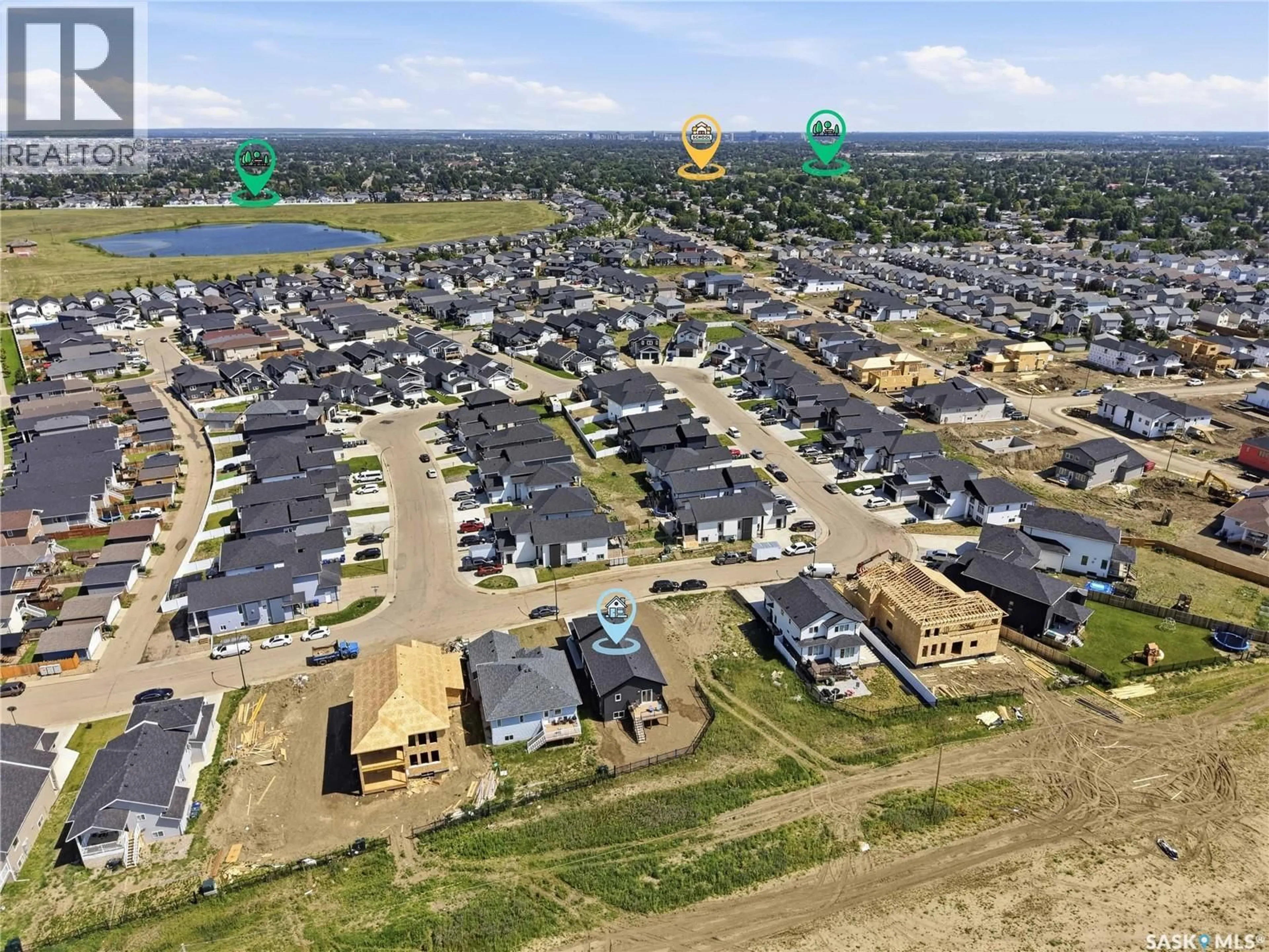 A pic from outside/outdoor area/front of a property/back of a property/a pic from drone, street for 902 BENTLEY MANOR, Saskatoon Saskatchewan S7L6P4