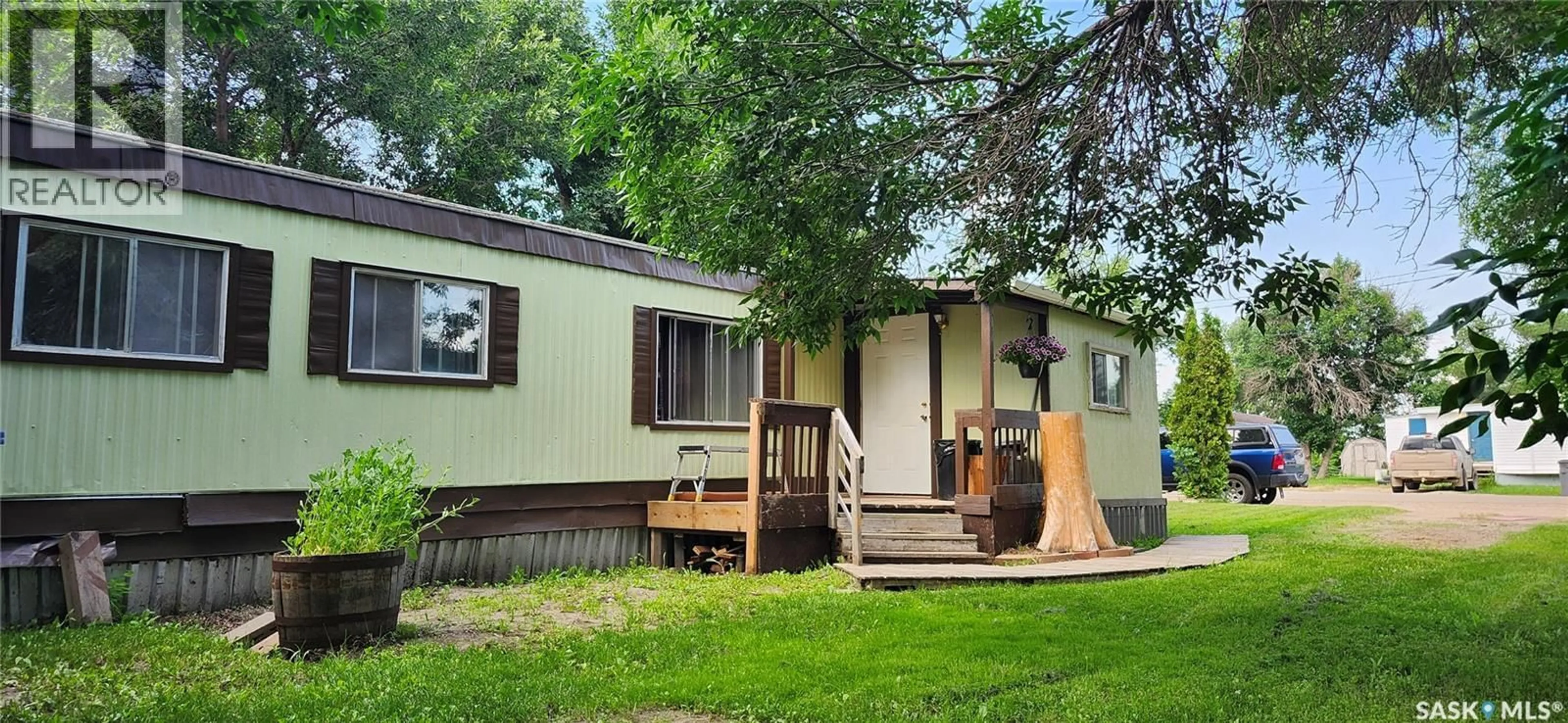 Home with vinyl exterior material, street for 106 LARCH STREET, Caronport Saskatchewan S0H0S0