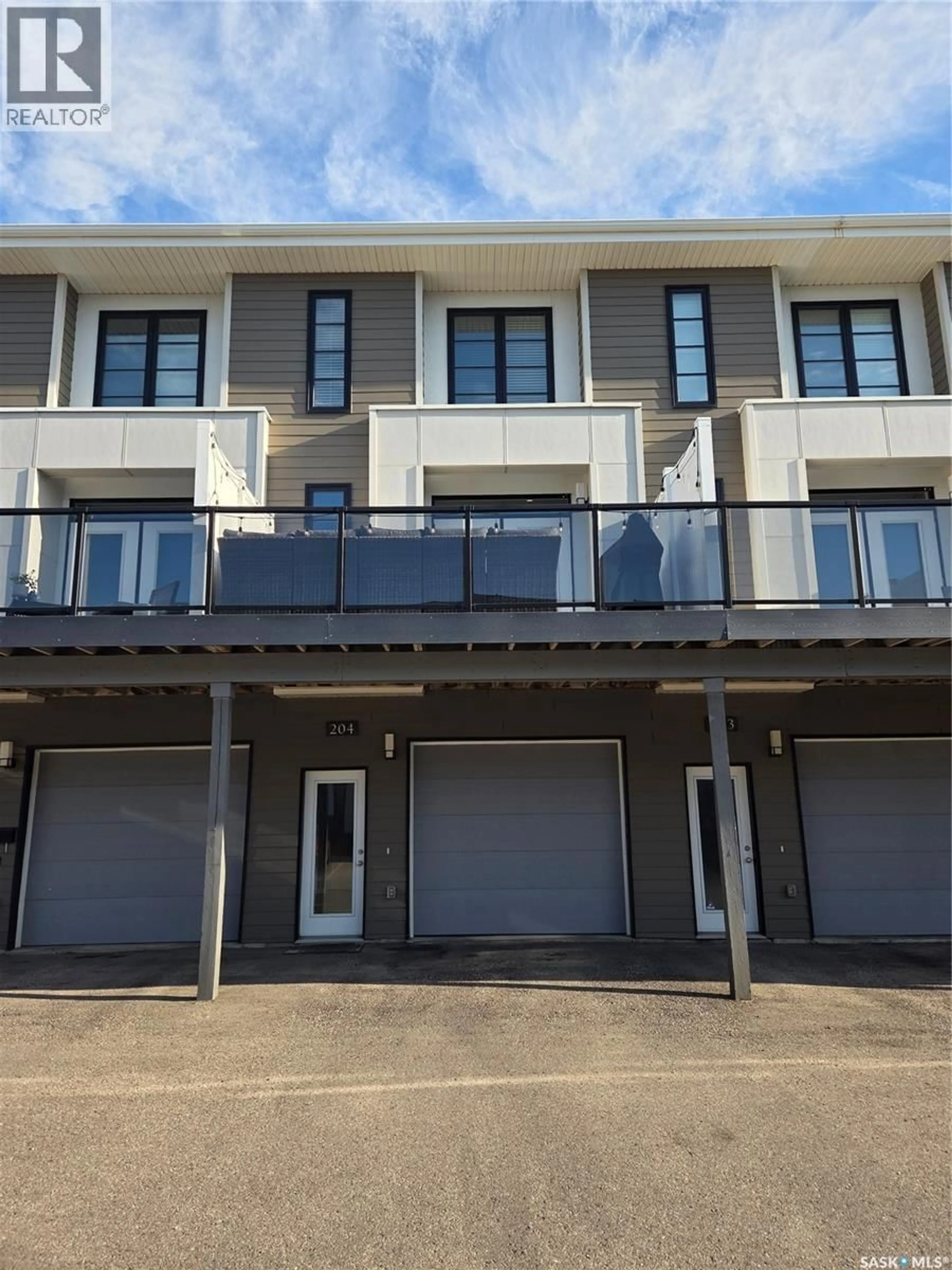 A pic from outside/outdoor area/front of a property/back of a property/a pic from drone, street for 204 - 3229 ELGAARD DRIVE, Regina Saskatchewan S4X0L2