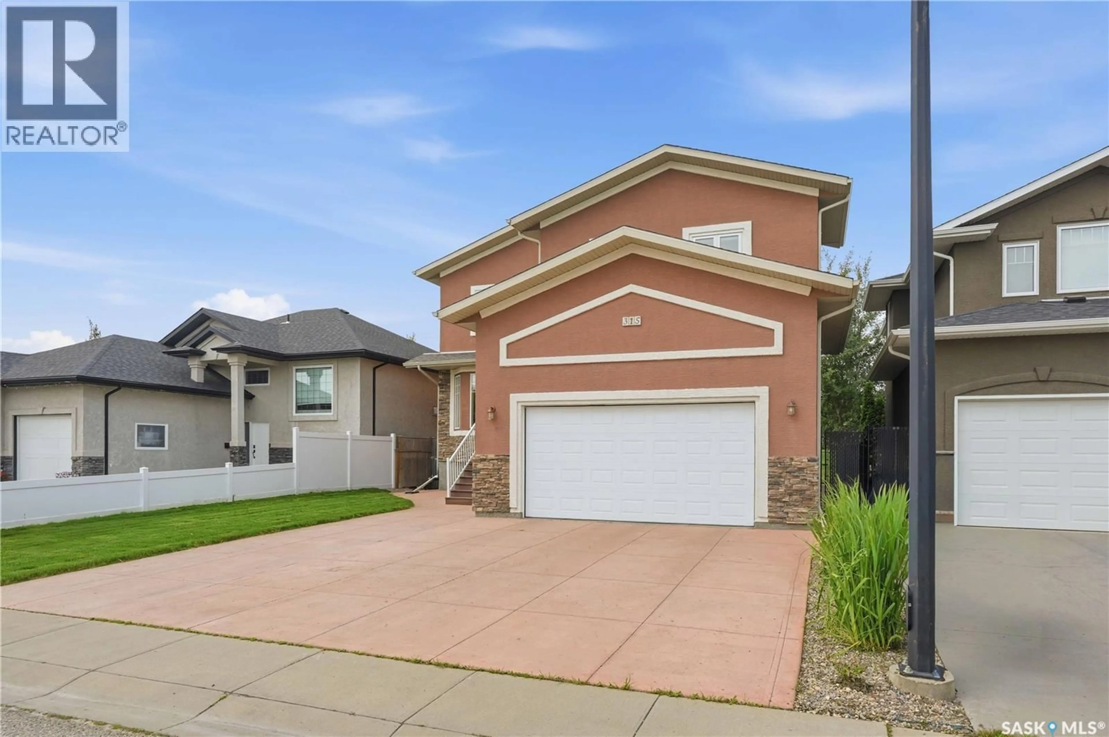 Home with brick exterior material, street for 315 WATERS CRESCENT, Saskatoon Saskatchewan S7W0A5