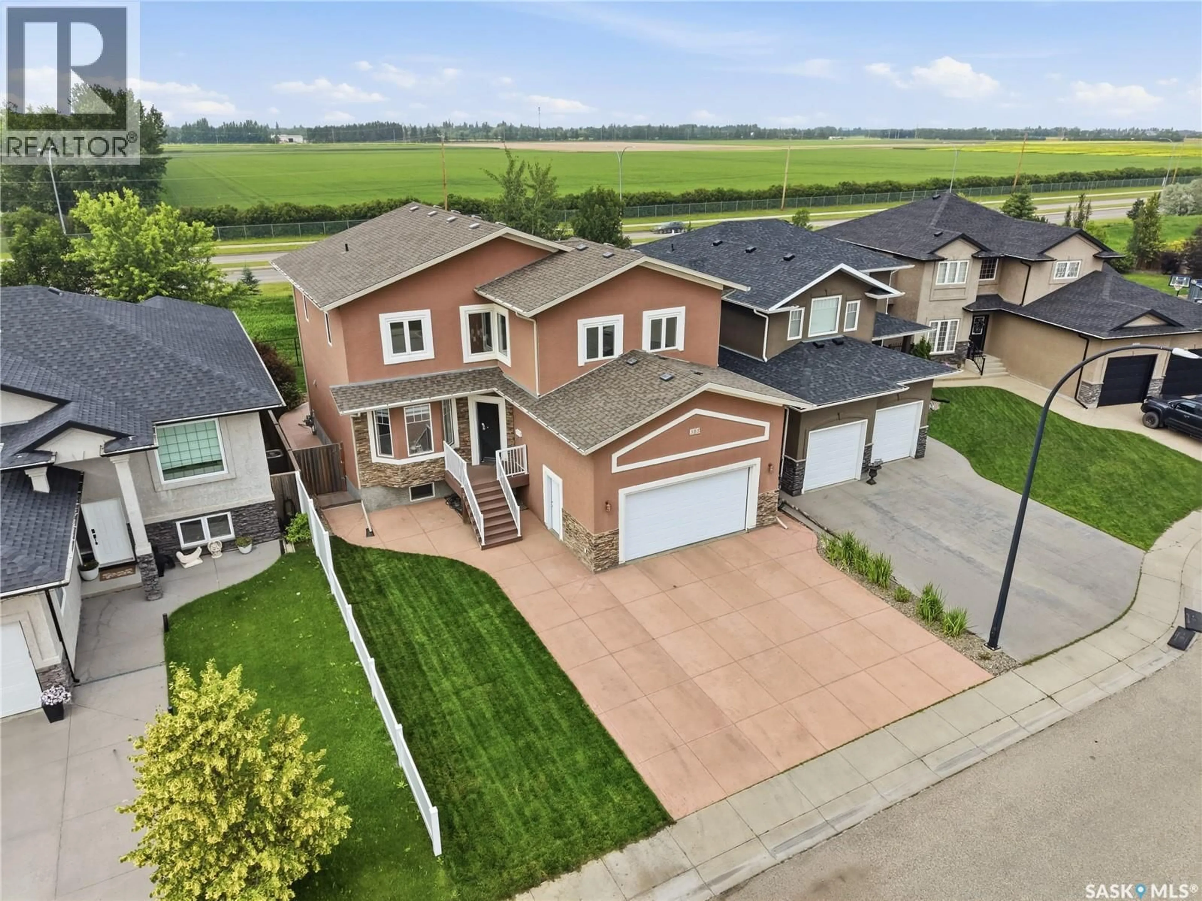A pic from outside/outdoor area/front of a property/back of a property/a pic from drone, street for 315 WATERS CRESCENT, Saskatoon Saskatchewan S7W0A5