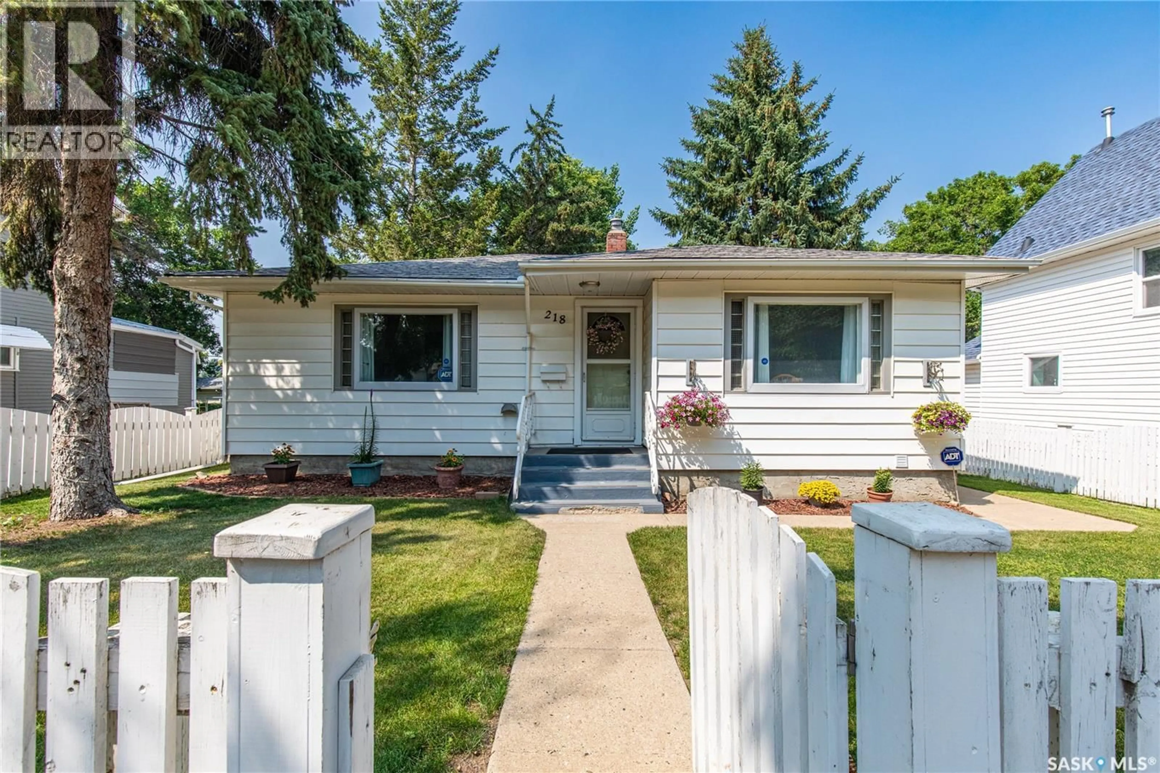Home with vinyl exterior material, street for 218 COTEAU STREET, Moose Jaw Saskatchewan S6H5C7