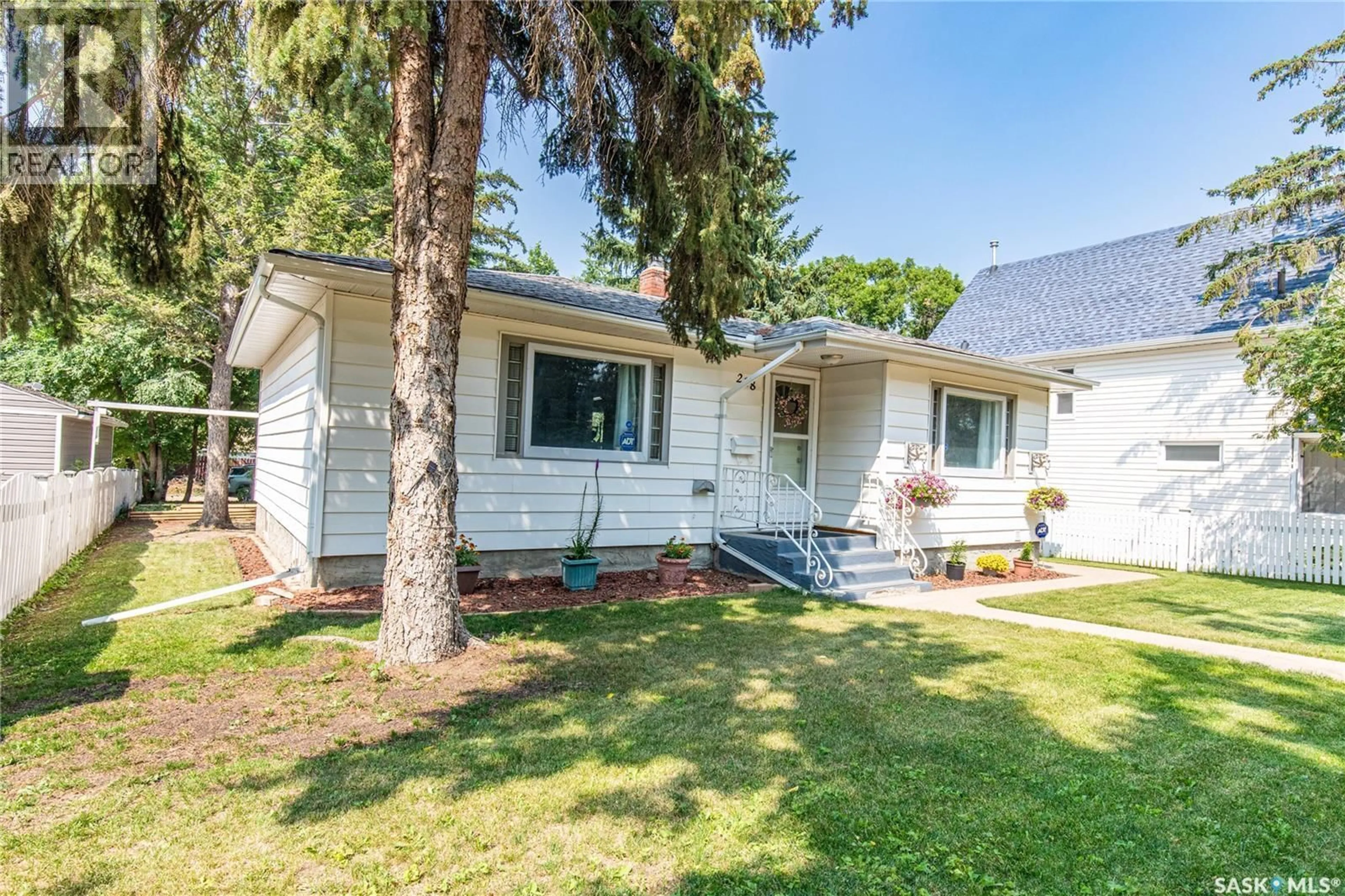 Home with vinyl exterior material, street for 218 COTEAU STREET, Moose Jaw Saskatchewan S6H5C7