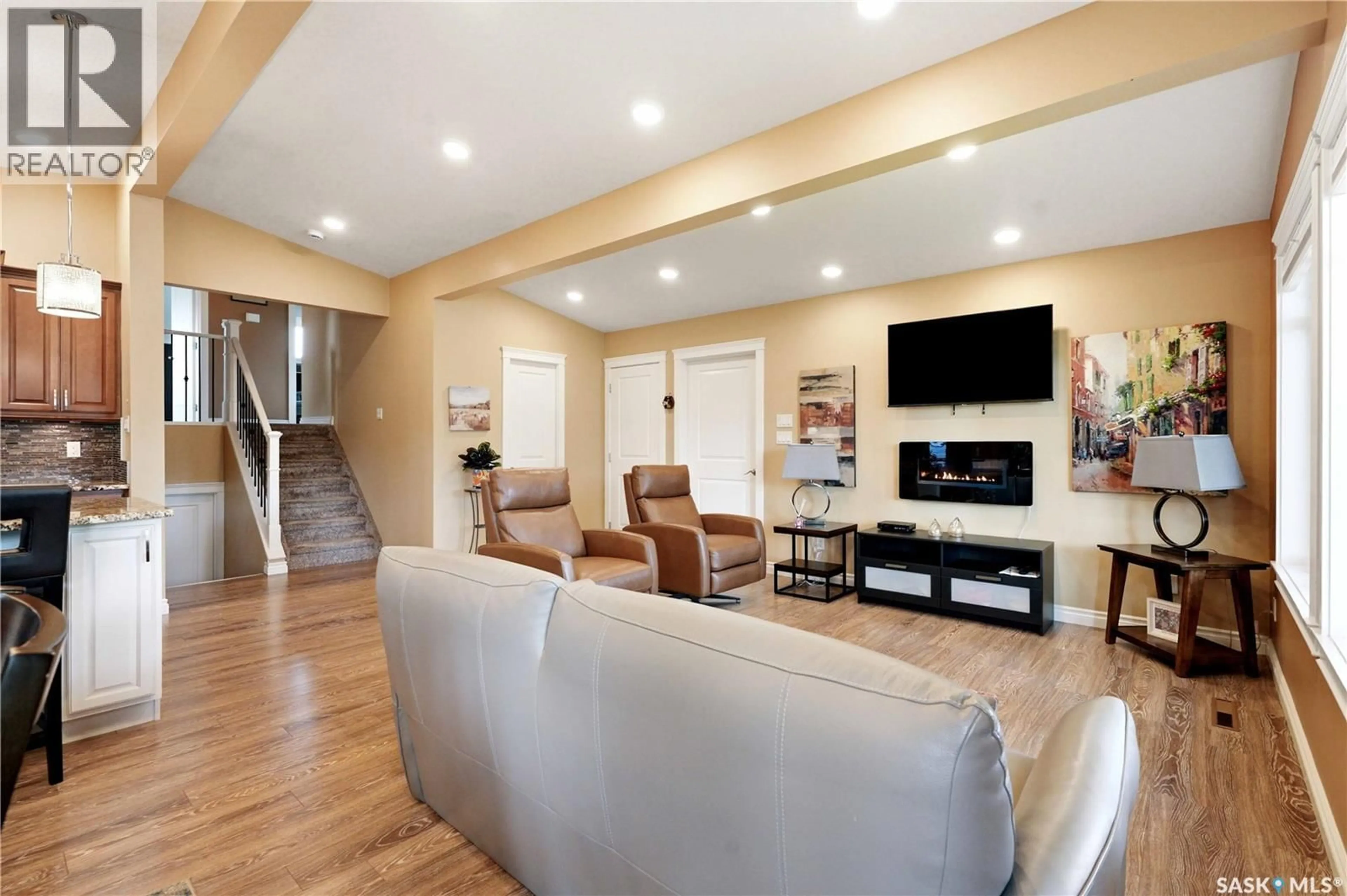 Living room with furniture, wood/laminate floor for 1710 CAMERON AVENUE, Saskatoon Saskatchewan S7H3N3